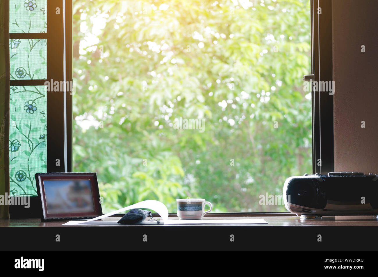A Work Desk With A Natural Atmosphere Outside The Window With The