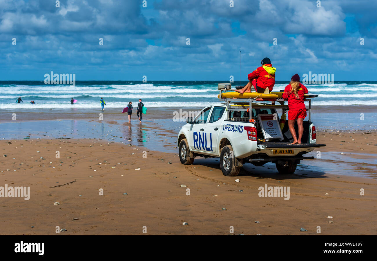 RNLI Lifeguards Cornwall - RNLI Beach Lifeguards on patrol in North Cornwall UK Stock Photo