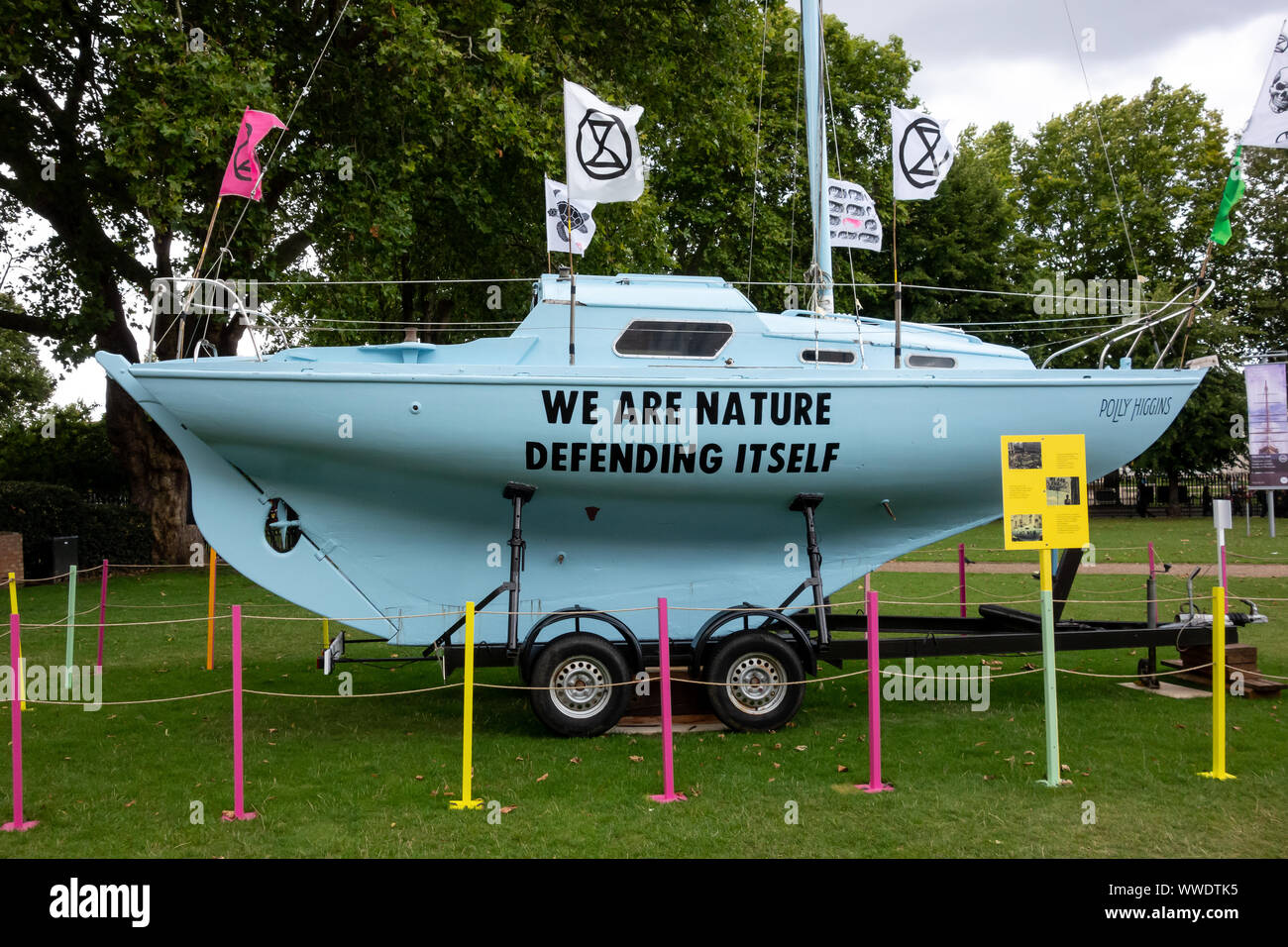 'Act Now' The 'Polly Higgins' Extinction Rebellion protest sailing boat on display at the National Maritime Museum on the 18th of August 2019 Stock Photo