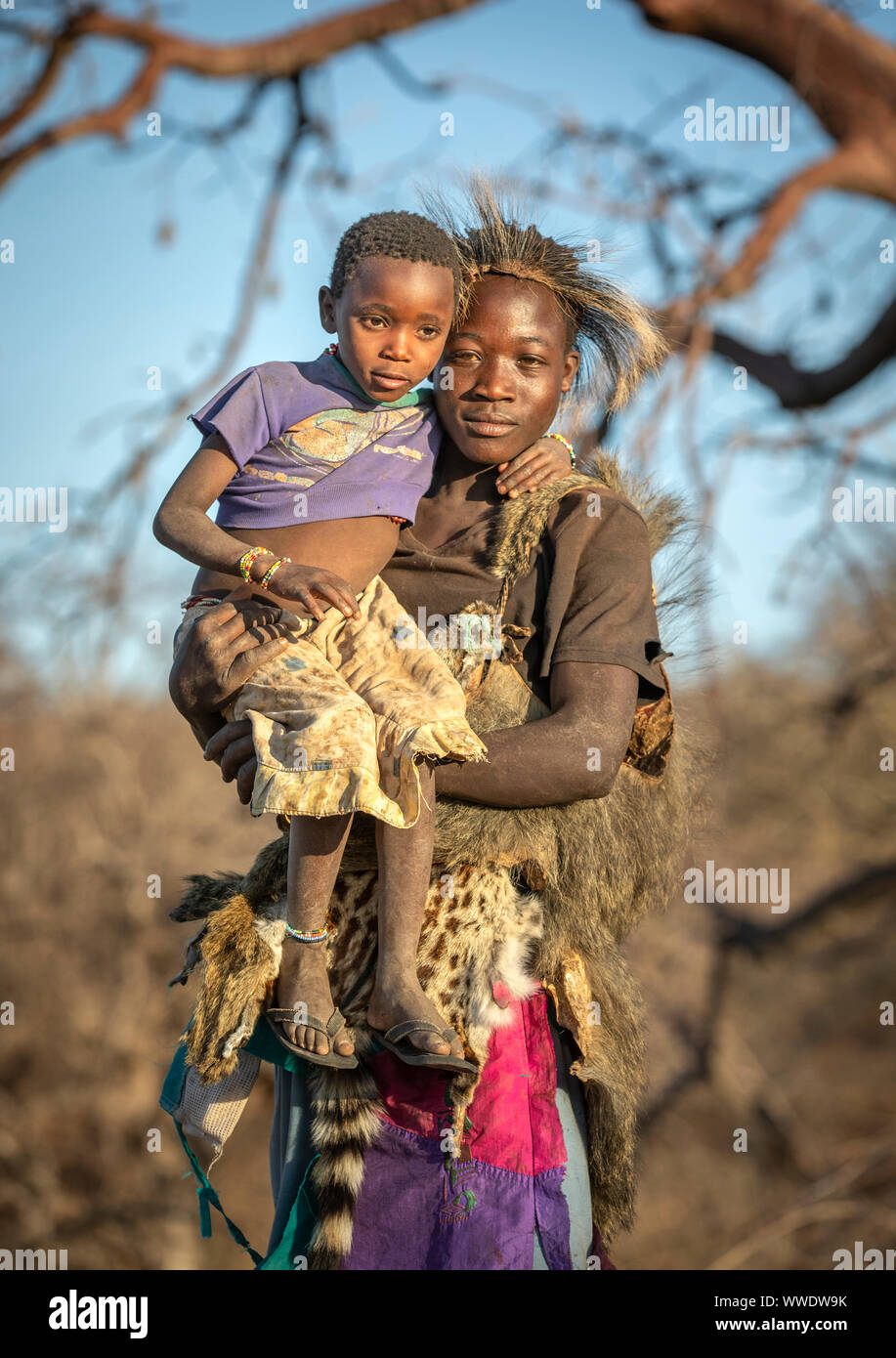 Lake Eyasi, Tanzania, 11th September 2019: Hadzabe man with his kid Stock Photo