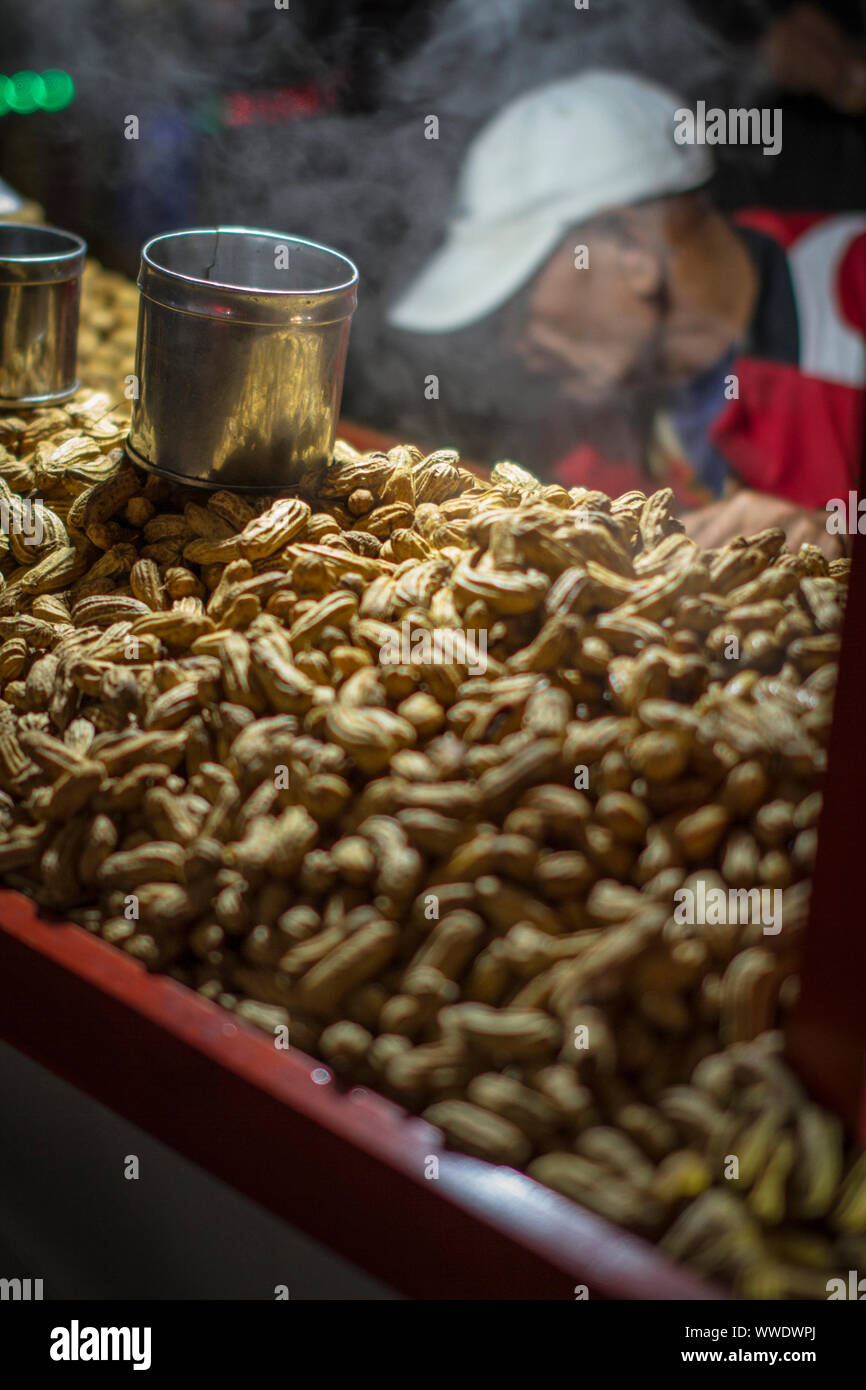 Ground peanuts on the cart at the street market Stock Photo