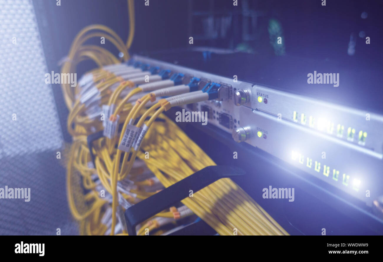 Fiber optical cables patch panel and switch Stock Photo