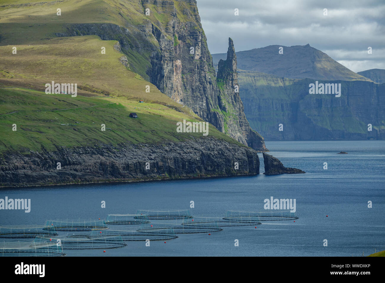 Faroe Islands, Sandavagur long shot with fish farms, Witch's Finger Stock Photo