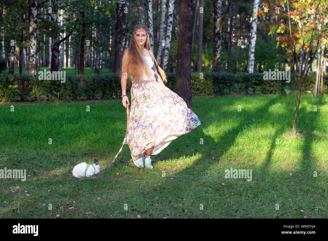 hippie girl dancing with a rabbit  culture festival, Stock Photo