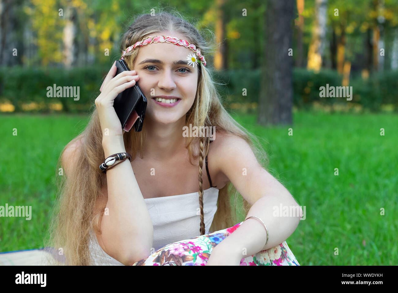 hippie girl  speaks on the phone romantic vintage Stock Photo