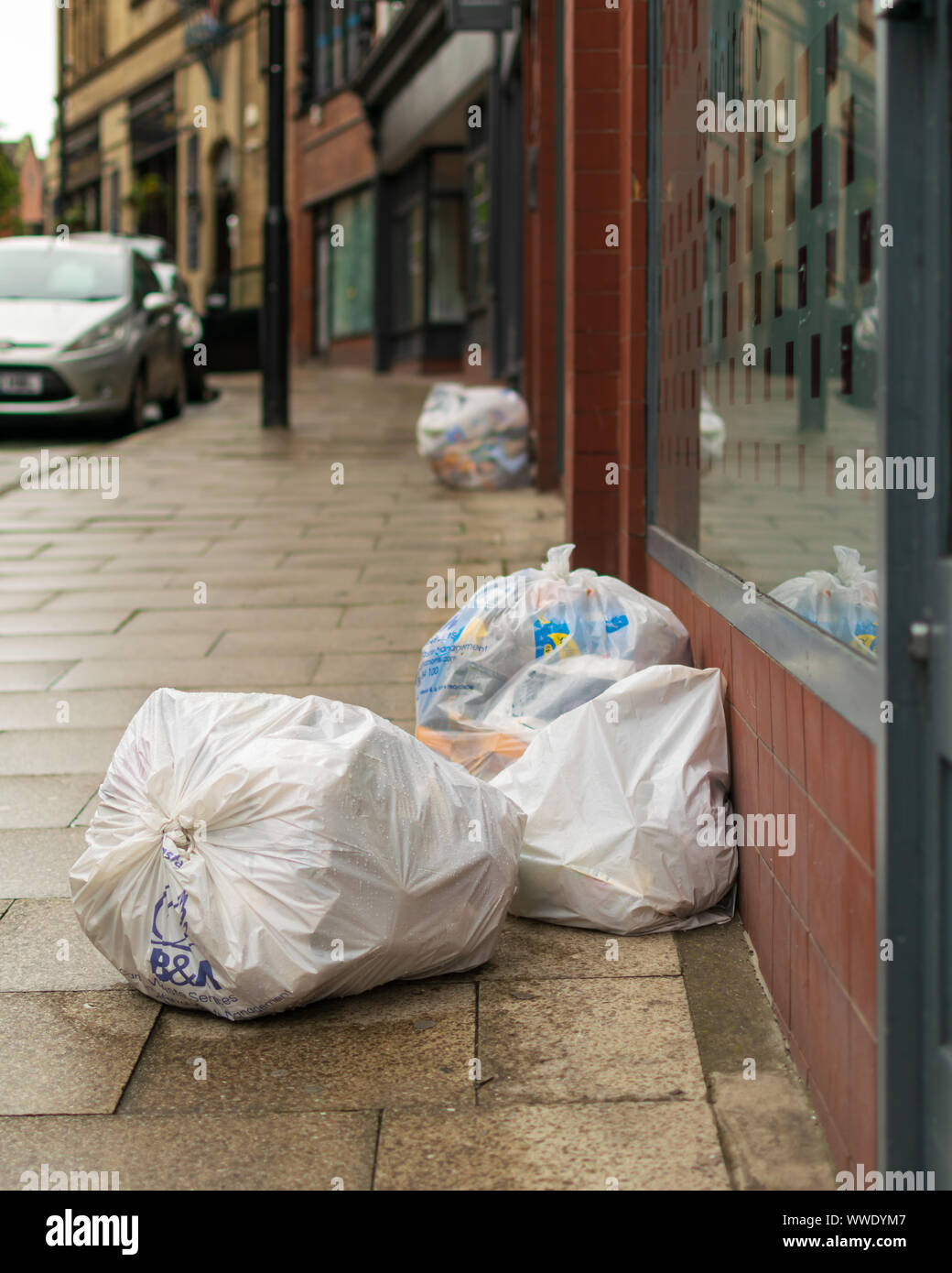 Rubbish bags on the street hi-res stock photography and images - Alamy