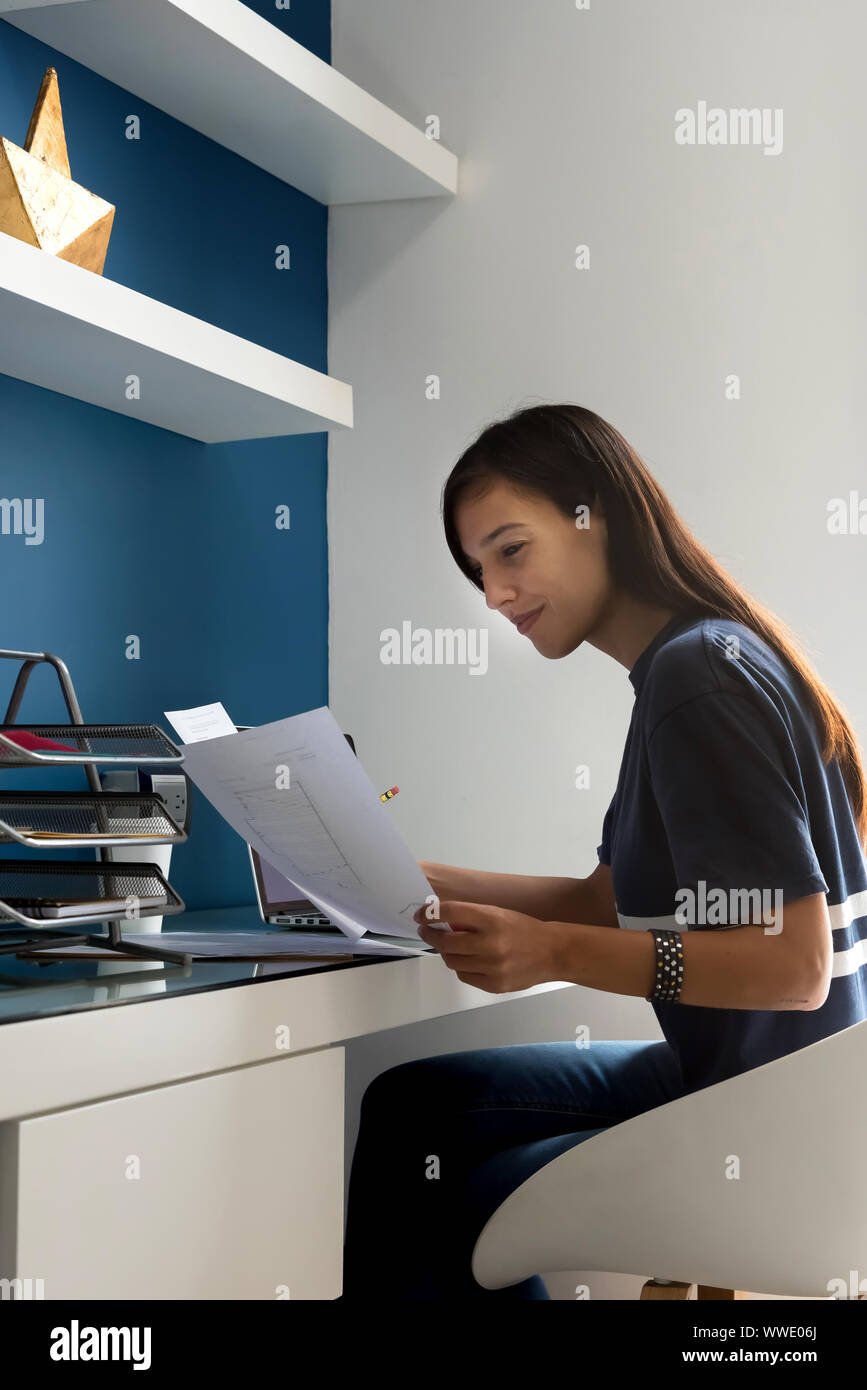 Architect woman working on some blueprints Stock Photo