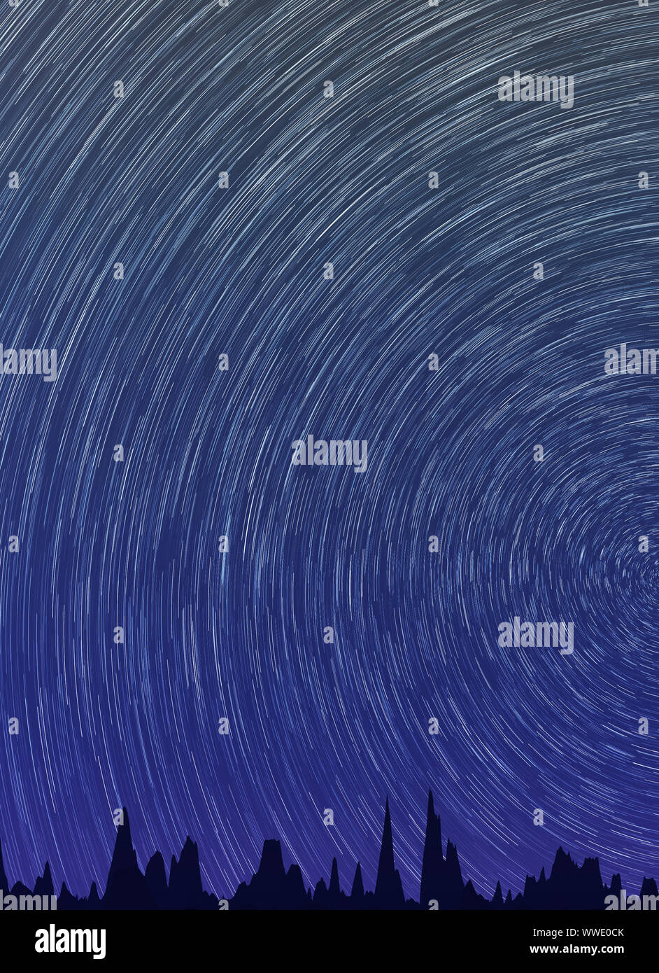 Abstract background with star trails in the night sky and rocks ...