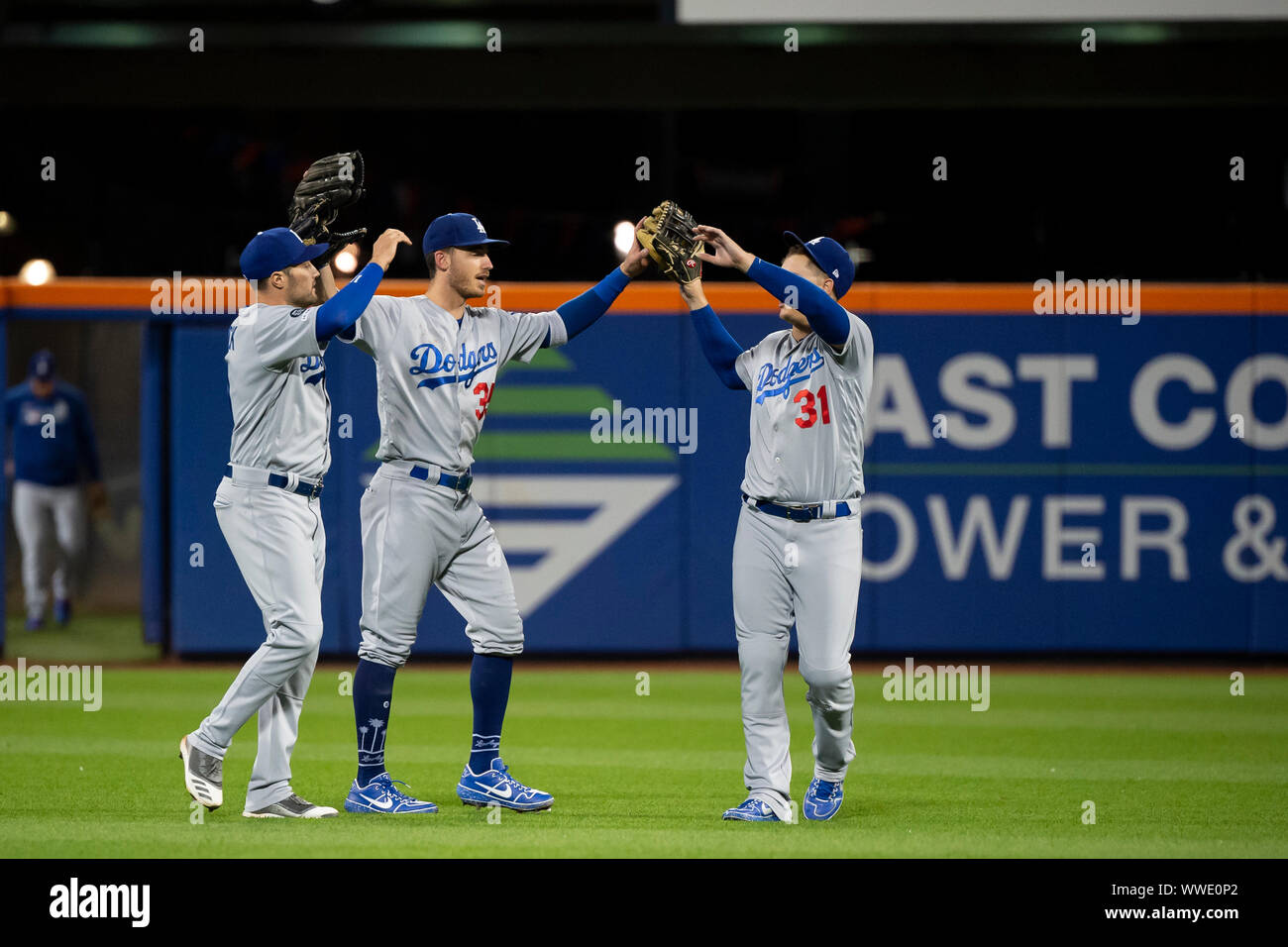 September 13, 2019: Los Angeles Dodgers right fielder Cody Bellinger (35) and Los Angeles Dodgers left fielder Joc Pederson (31) celebrate after the win during the game between The New York Mets and The Los Angeles Dodgers at Citi Field in Queens, New York. Mandatory credit: Kostas Lymperopoulos/CSM Stock Photo
