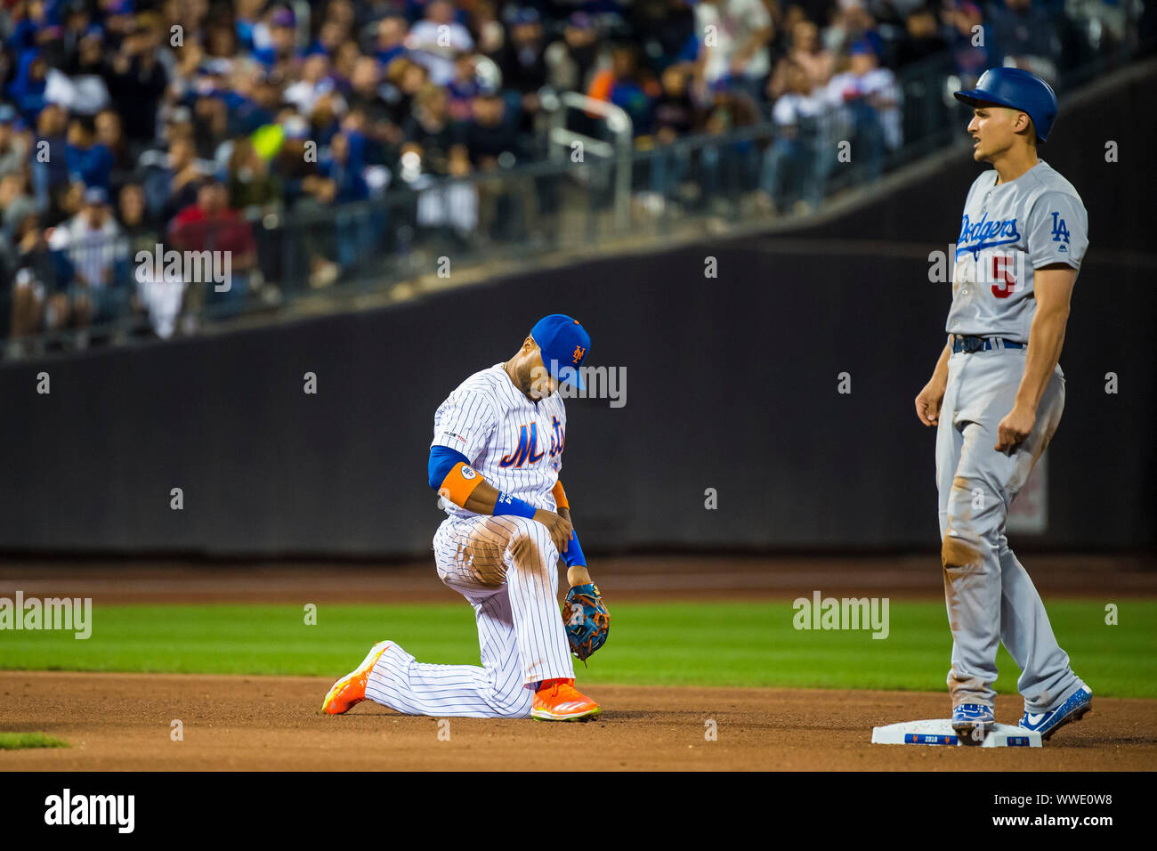 September 13, 2019: New York Mets second baseman Robinson Cano (24) is down on one knee after Los Angeles Dodgers shortstop Corey Seager (5) was safe at second base during the game between The New York Mets and The Los Angeles Dodgers at Citi Field in Queens, New York. Mandatory credit: Kostas Lymperopoulos/CSM Stock Photo