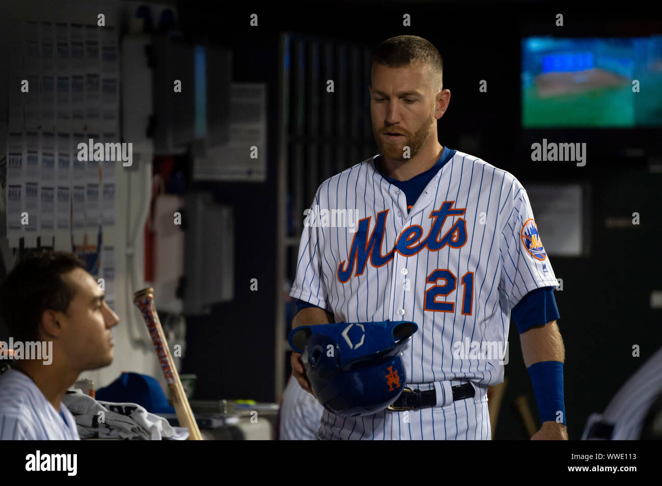 Queens, New York, USA. 13th Sep, 2019. New York Mets third baseman Todd Frazier (21) grabs his helmet in the dugout during the game between The New York Mets and The Los Angeles Dodgers at Citi Field in Queens, New York. Mandatory credit: Kostas Lymperopoulos/CSM/Alamy Live News Stock Photo