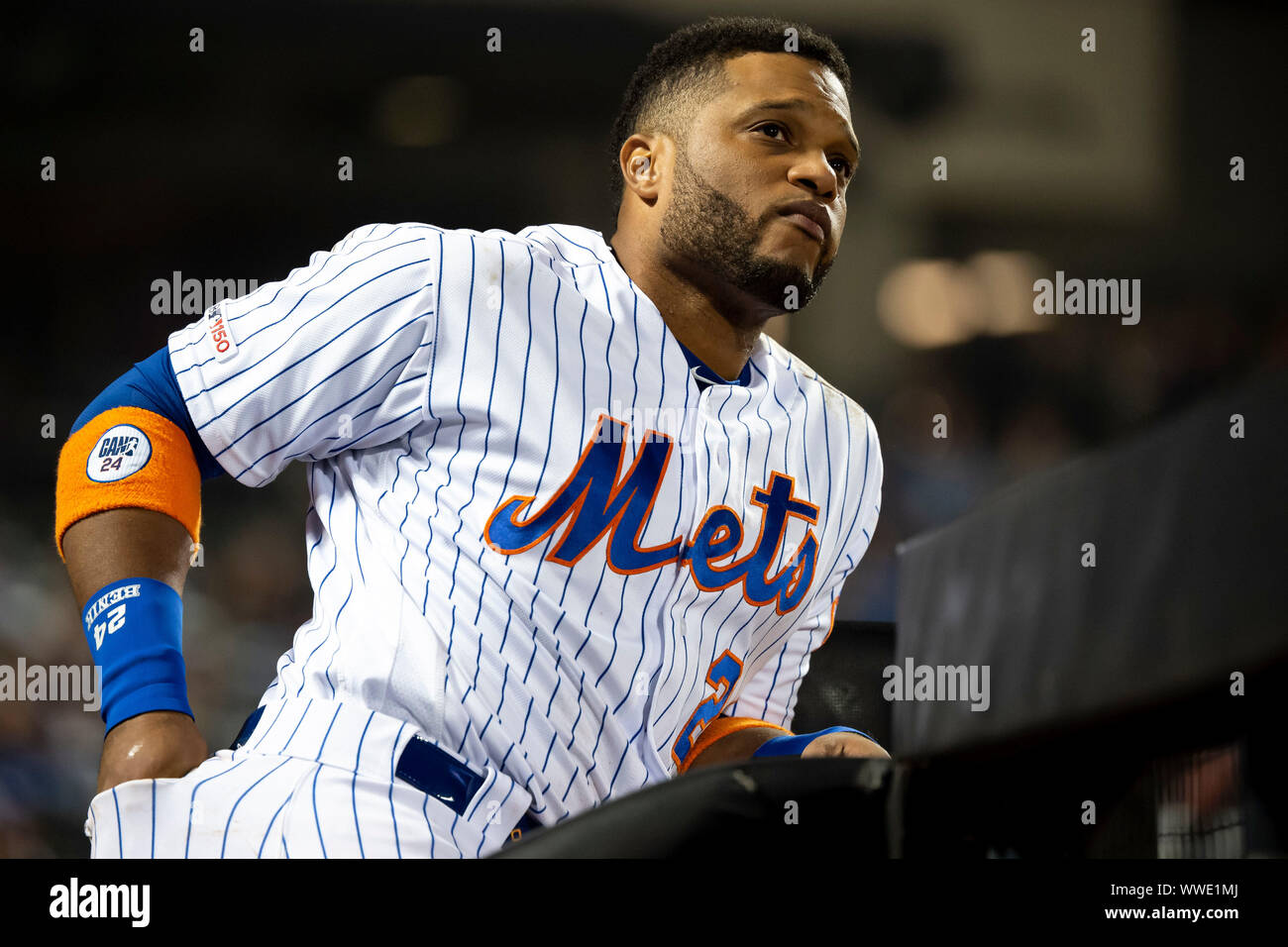 Queens, New York, USA. 13th Sep, 2019. New York Mets second baseman Robinson Cano (24) looks on from the top of the dugout during the game between The New York Mets and The Los Angeles Dodgers at Citi Field in Queens, New York. Mandatory credit: Kostas Lymperopoulos/CSM/Alamy Live News Stock Photo