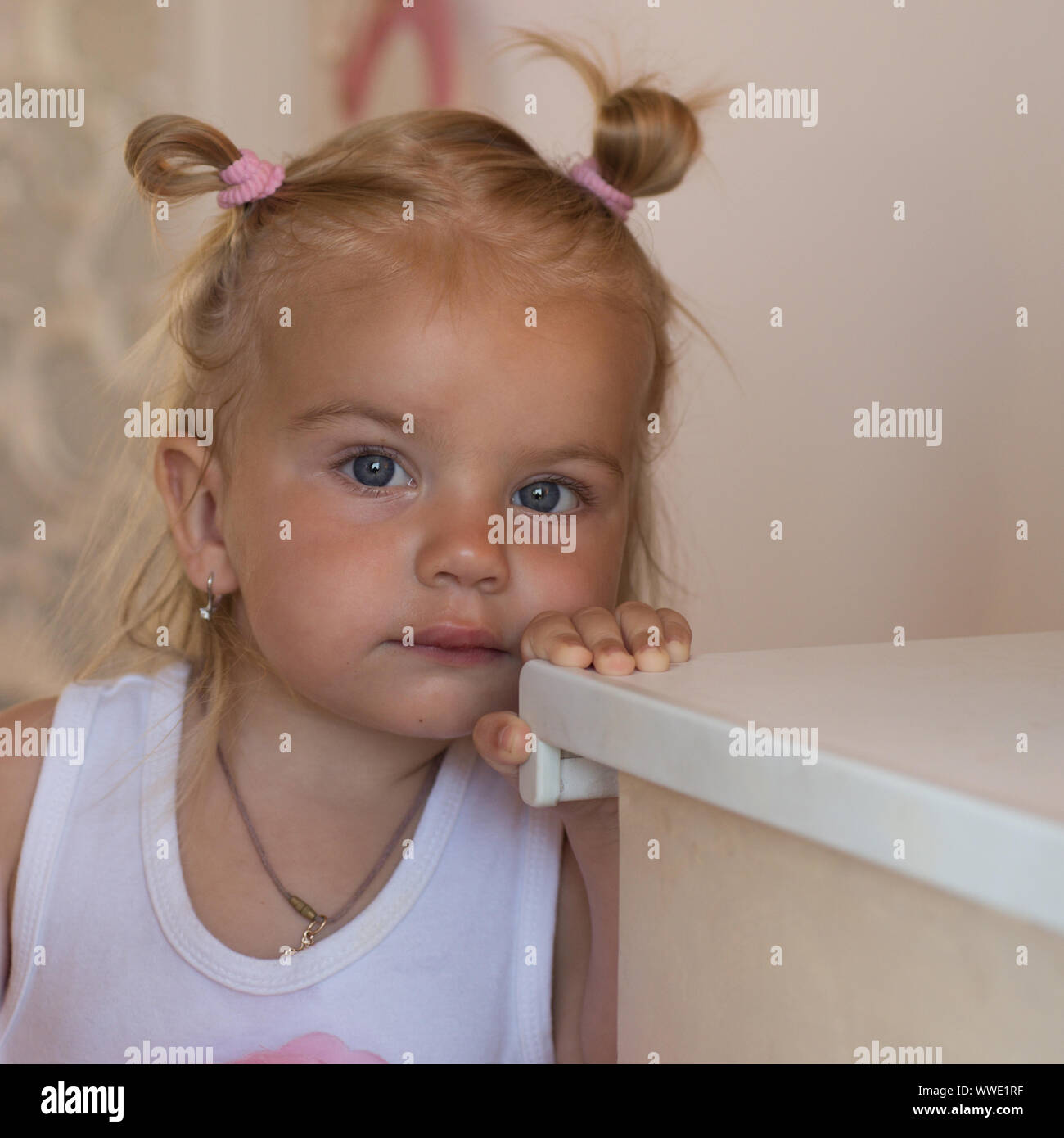 The hairstyle is beautiful. Small child wear funny hairstyle. Small girl  with bun ponytails. Adorable child with blond hair. Fancy girls hairstyle.  Ha Stock Photo - Alamy