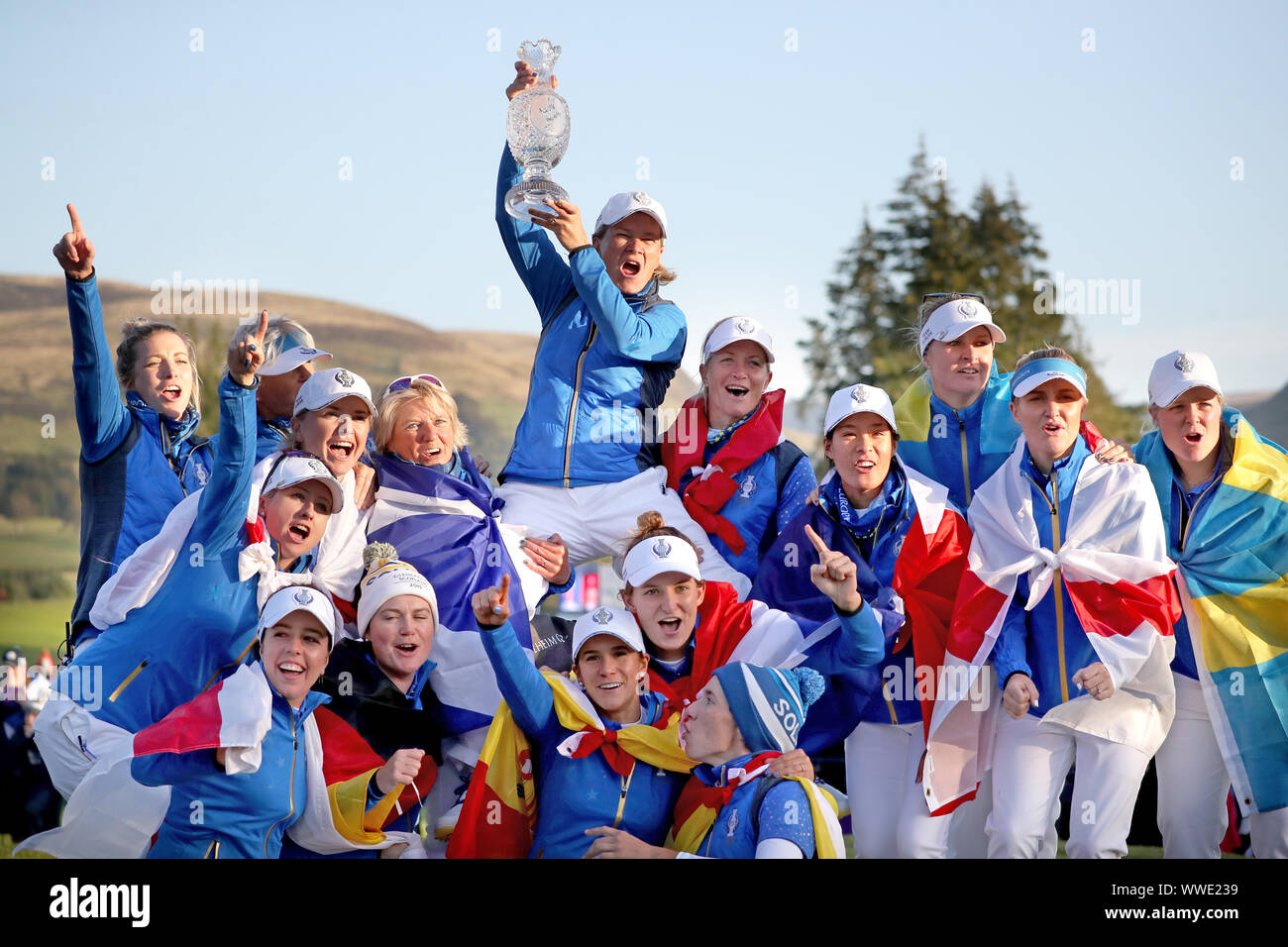 Team Europe captain Catriona Matthew (top) celebrates with her team and the trophy after winning the 2019 Solheim Cup at Gleneagles Golf Club, Auchterarder. Stock Photo