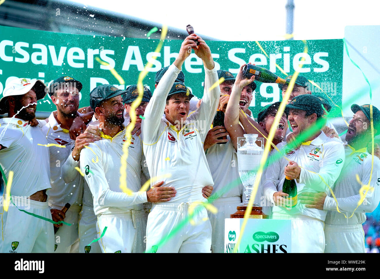 Australia players celebrate retaining the Ashes at the end of the fifth