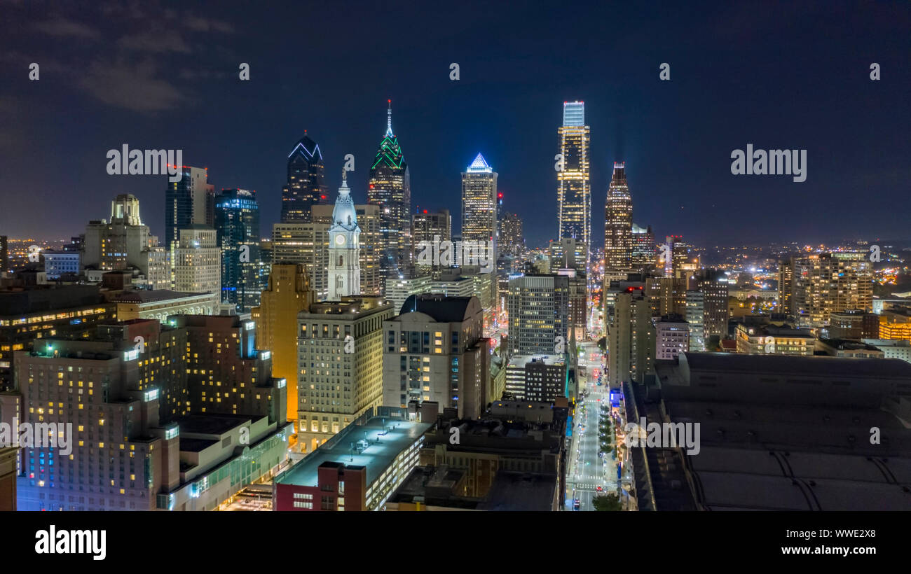Aerial view night sky over the neighborhoods and streets of