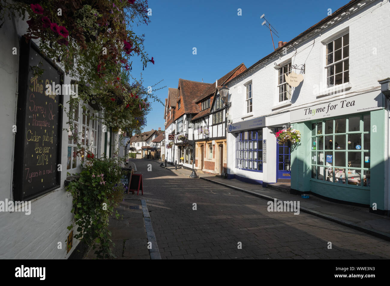 Picturesque Church Street in Godalming town centre, Surrey, UK, with the Star Inn, tea rooms and shops Stock Photo