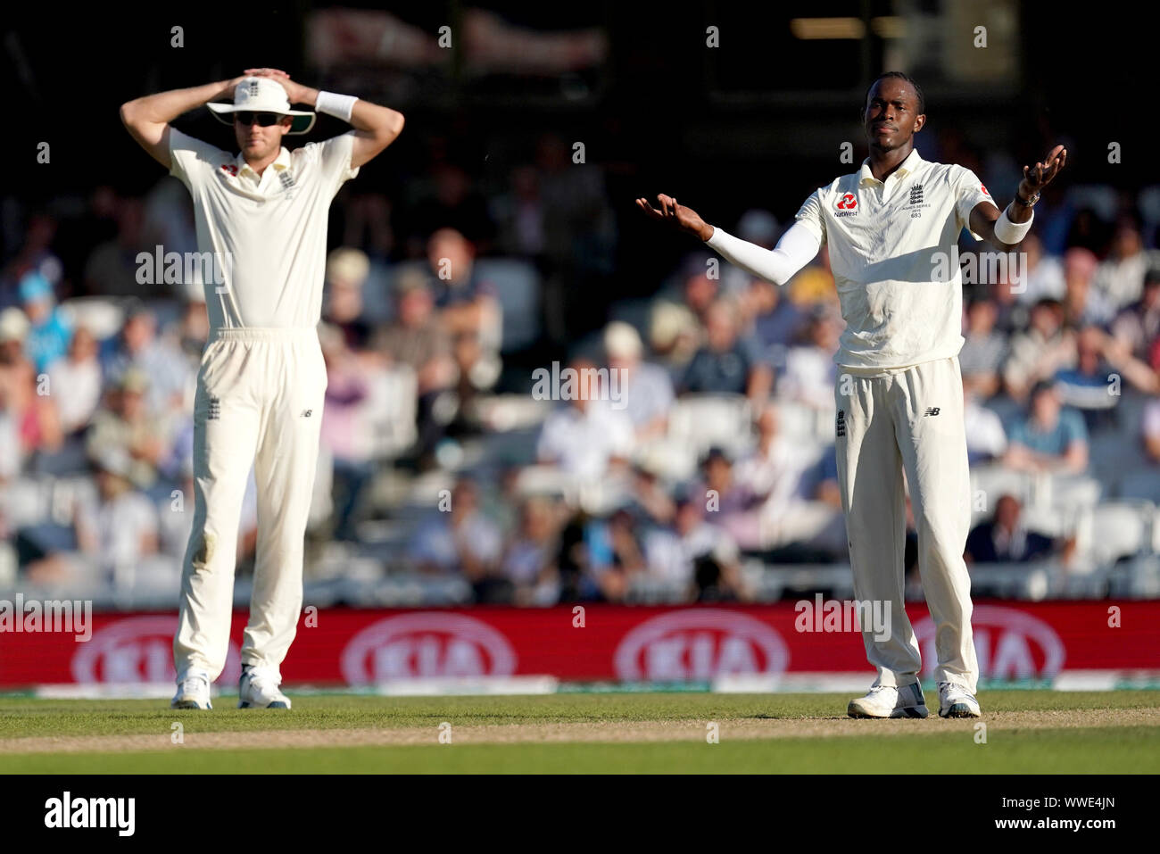 England's Jofra Archer (right) and Stuart Broad react during day four of the fifth test match at The Kia Oval, London. Stock Photo