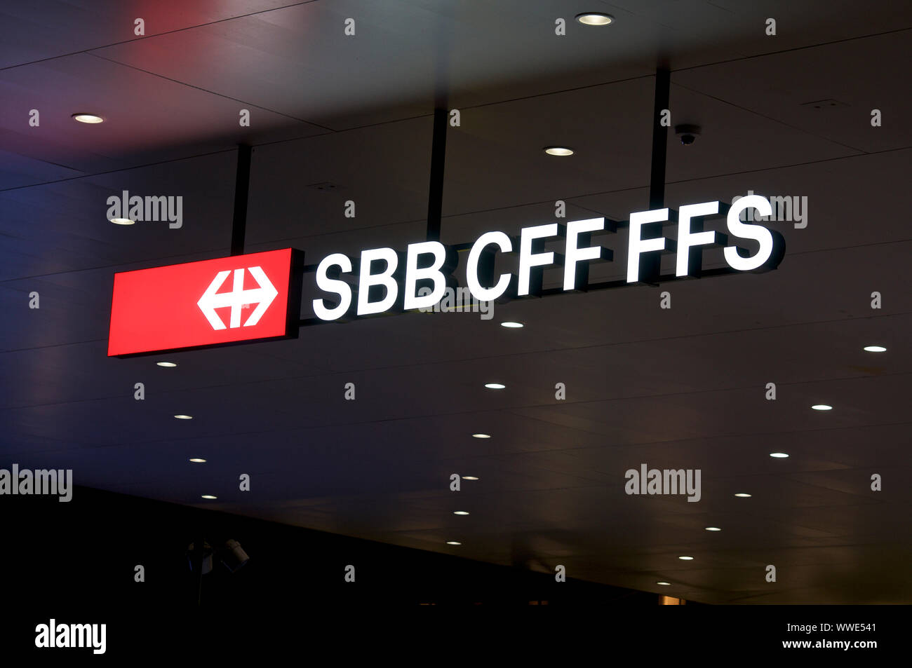 Lugano, Ticino, Switzerland - 17th August 2019 : View on the SBB / CFF / FFS (Swiss Federal Railways company) signage hanging from the ceiling of the Stock Photo