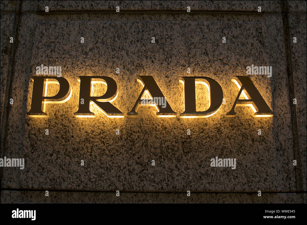 Lugano, Ticino, Switzerland - 17th August 2019 : Illuminated Prada logo  installed at the wall of the store in Lugano city, Switzerland. Prada is a  int Stock Photo - Alamy