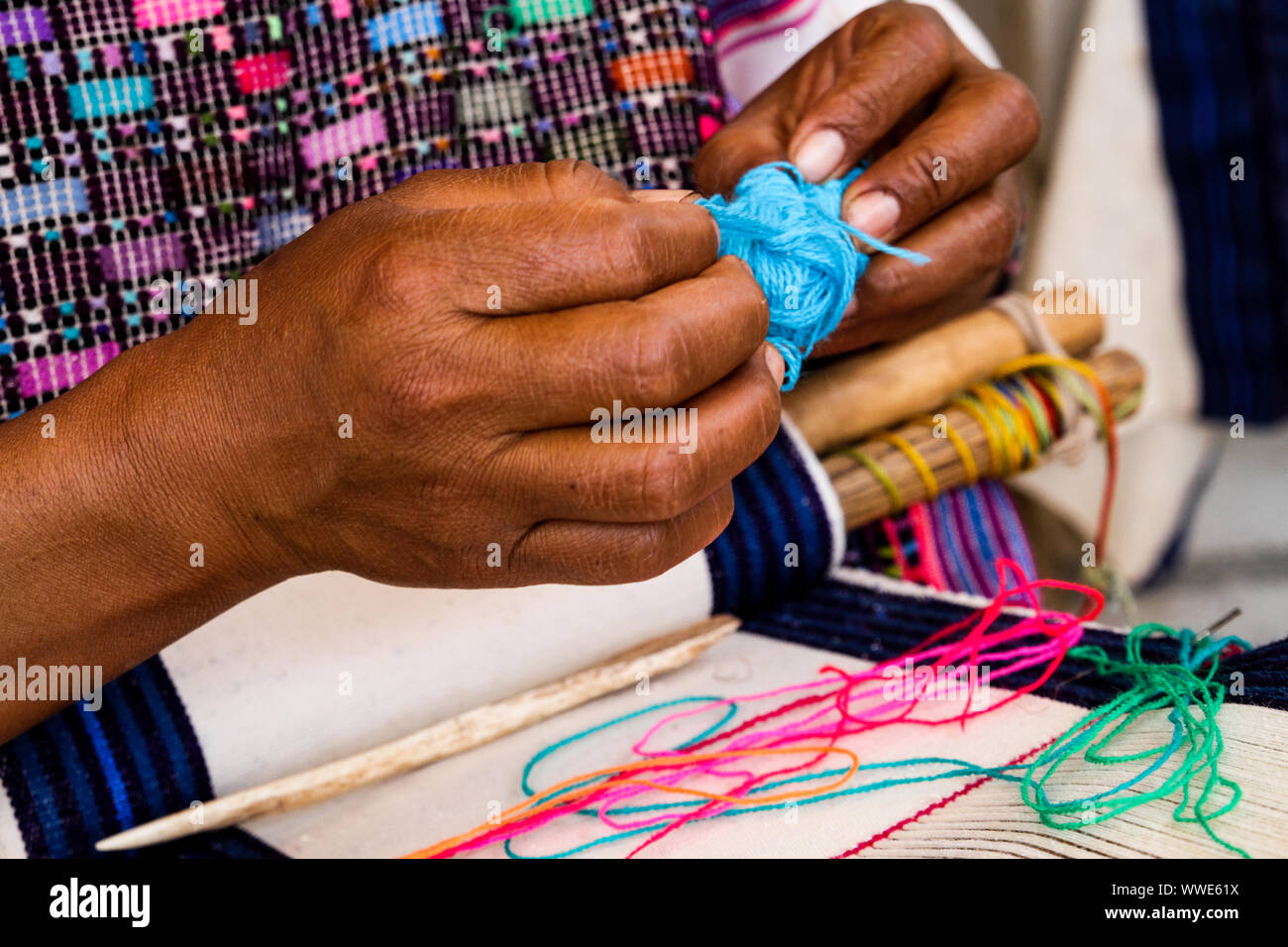 Woman's Hands Weaving Traditional Textiles in San Juan Cancuc, Chiapas