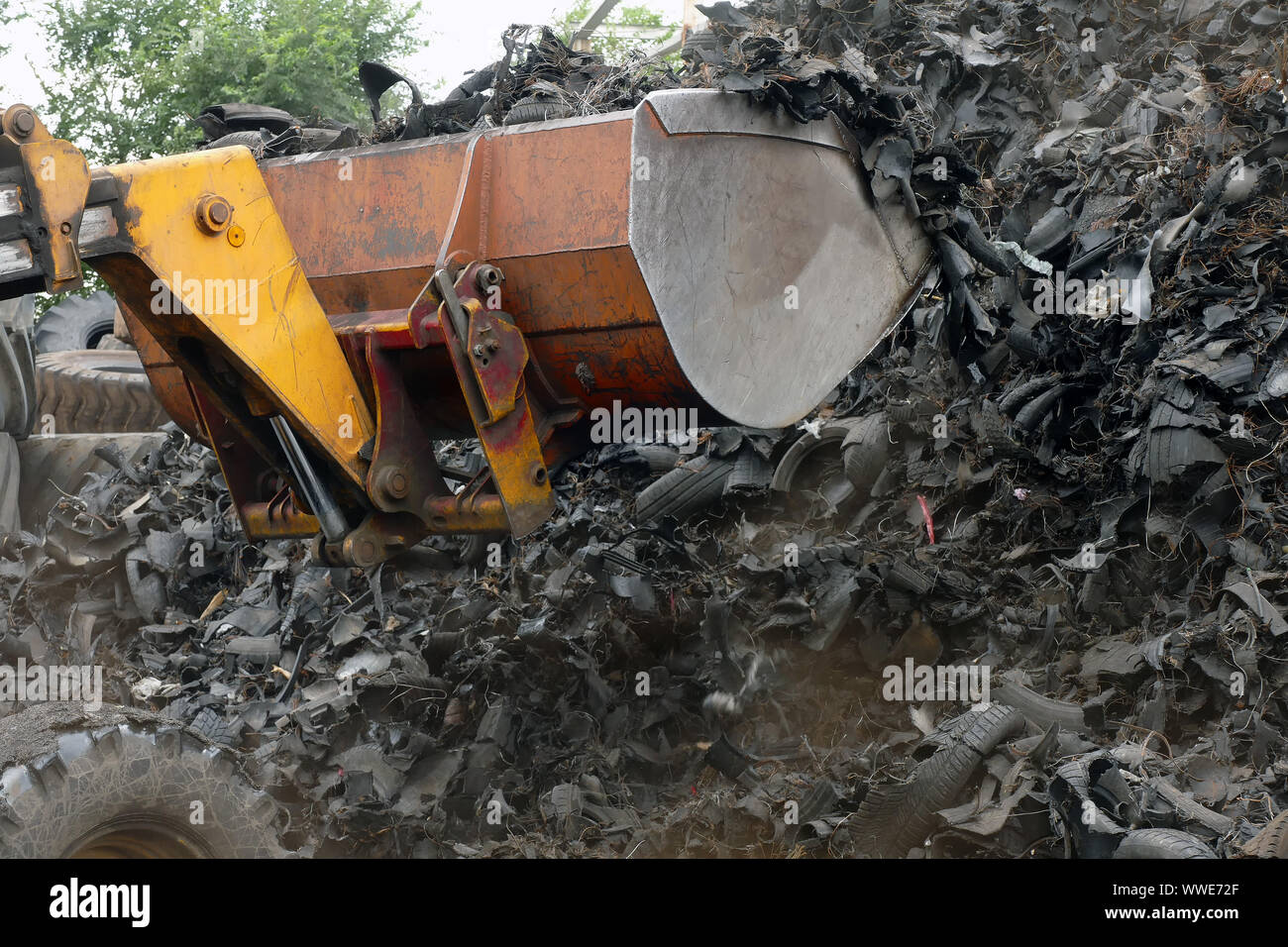 Wheel worn wear rubber tyre junkyard recycling heap hires stock