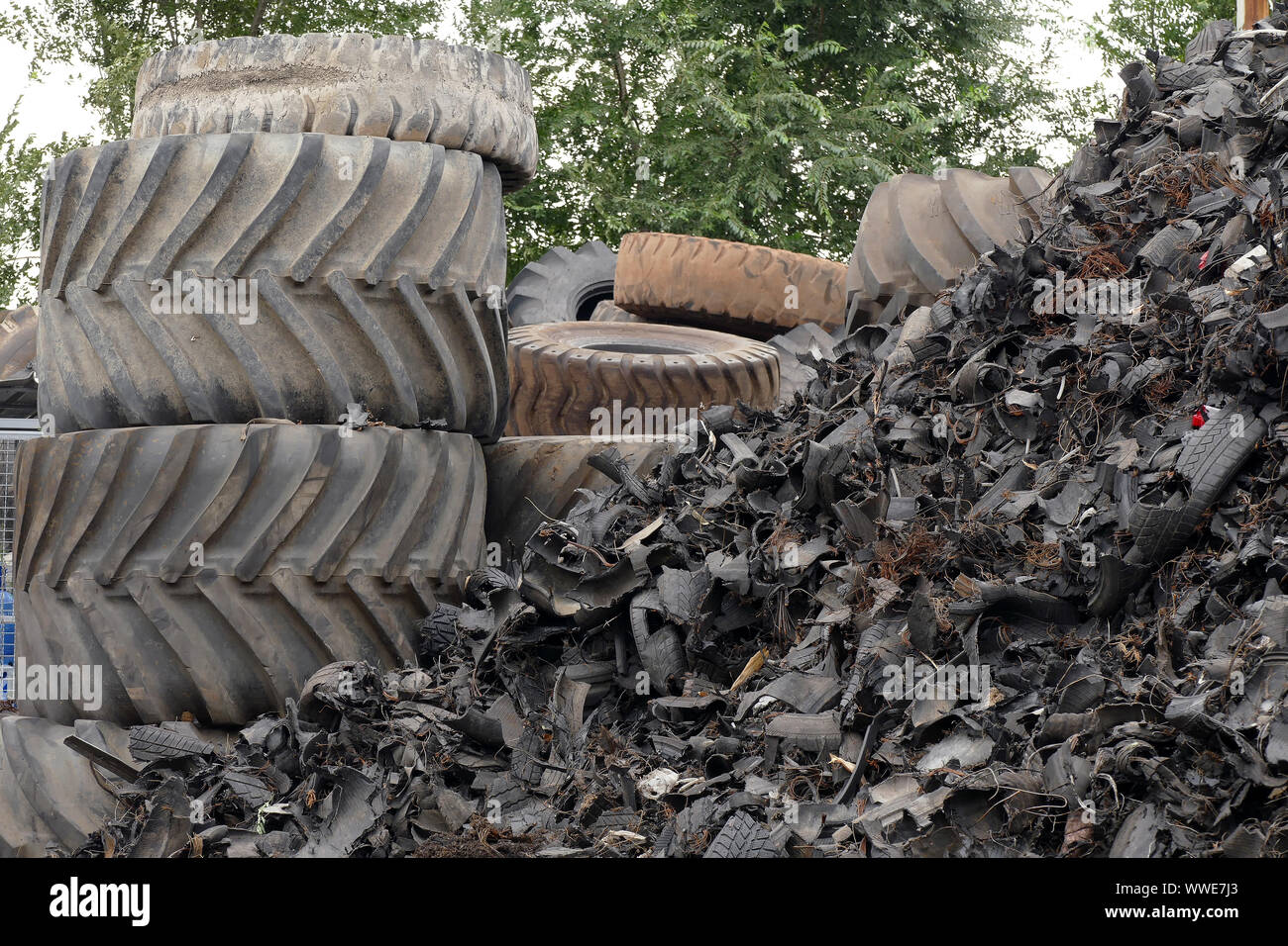 Wheel worn wear rubber tyre junkyard recycling heap hires stock