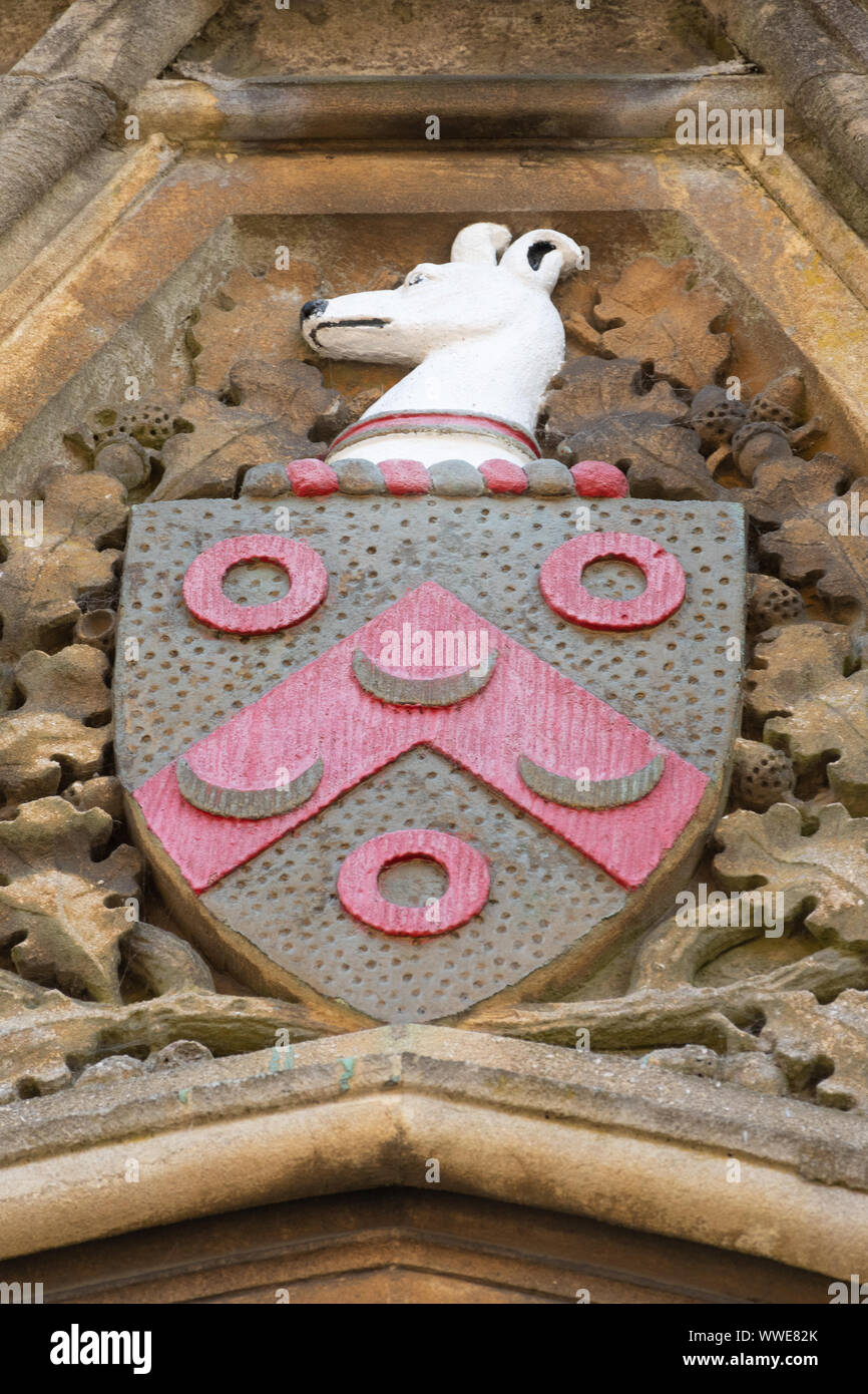 The heraldic shield of Thomas Sutton, the founder, with the greyhound head on Charterhouse School buildings in Surrey, England, UK Stock Photo