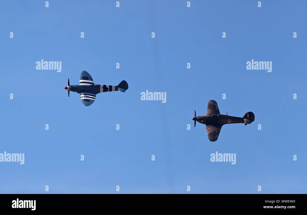 LONDON, ENGLAND. 15 SEPTEMBER 2019: A pair of ww2 Spitfire planes fly past the ground during day four of the 5th Specsavers Ashes Test Match, at The Kia Oval Cricket Ground, London, England. Stock Photo