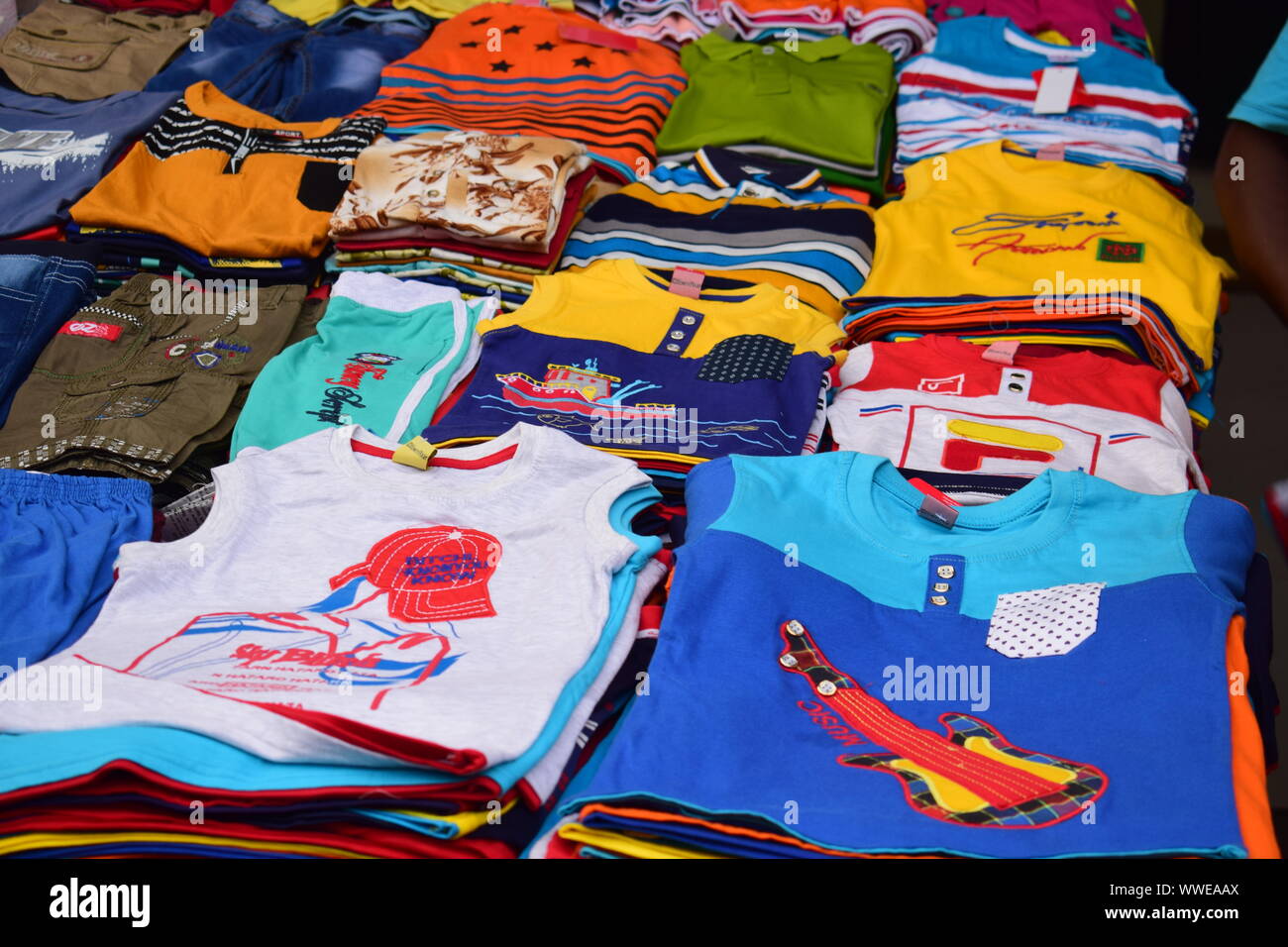 kids clothes for sale in a market Stock Photo Alamy