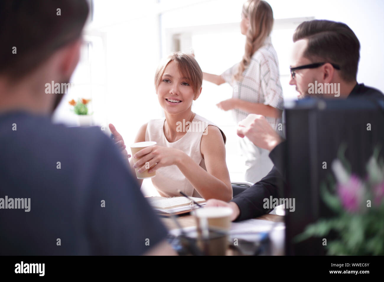 young business woman sitting at office Desk Stock Photo - Alamy