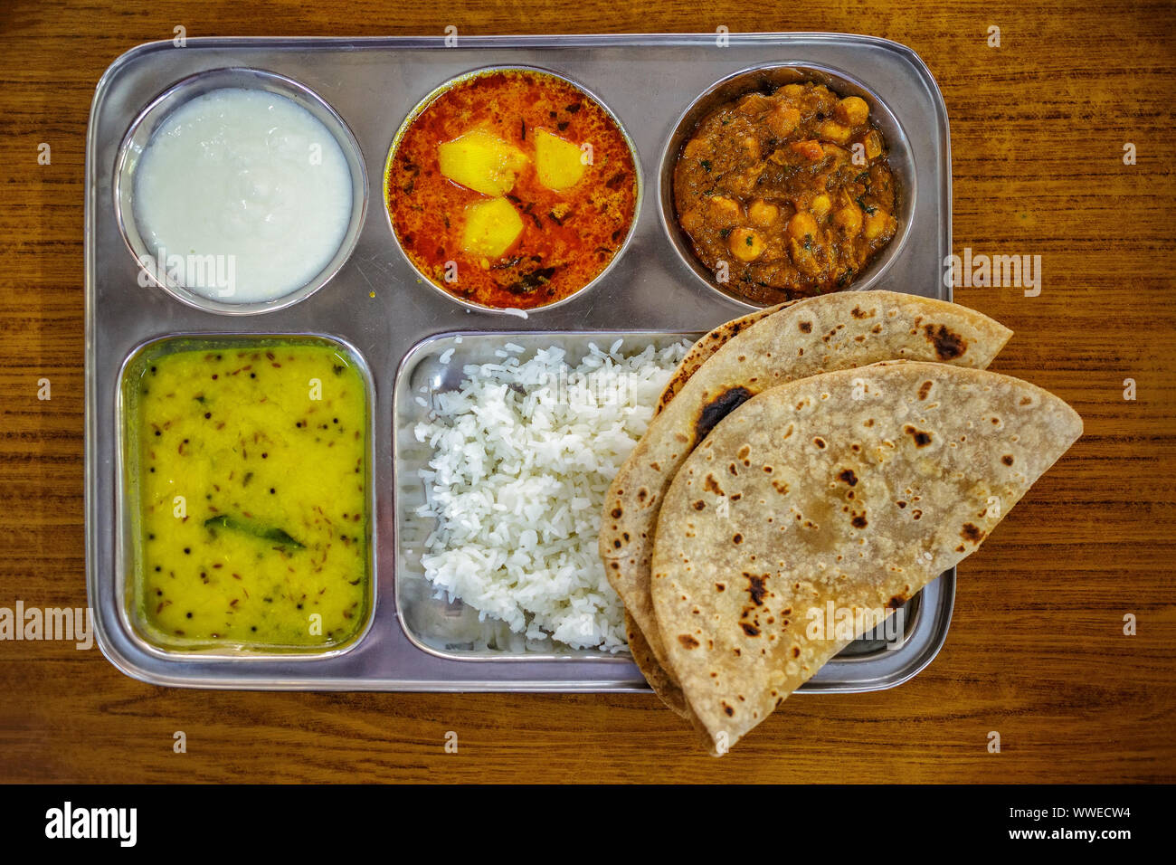 Thali Traditional Indian Food. Steel tray with multiple compartments
