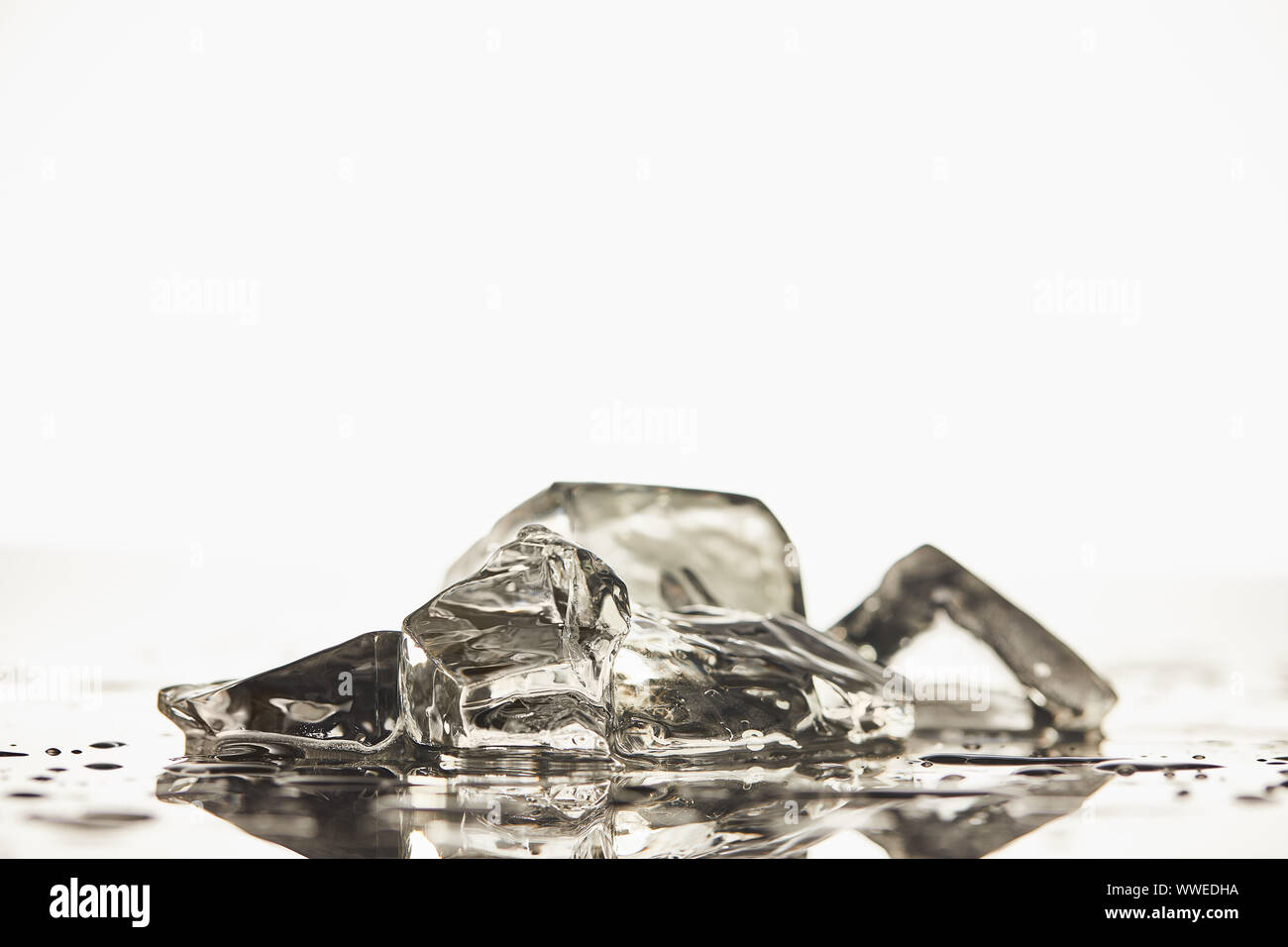 stack of transparent melted ice cubes on white background Stock Photo ...