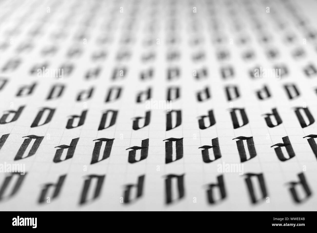 Calligraphy black and white letters D background. Lettering practice writing worksheet. Handwriting symbol filling pattern. Calligraphic letter D lear Stock Photo