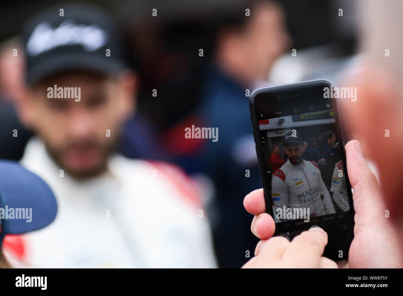 Derby, UK. 15th Sep, 2019. Beechdean AMR driver Kelvin Fletcher viewed through a fans mobile phone during the British GT Donington Park GP at Donington Park, Derby, England on 15 September 2019. Photo by Jurek Biegus. Editorial use only, license required for commercial use. No use in betting, games or a single club/league/player publications. Credit: UK Sports Pics Ltd/Alamy Live News Stock Photo