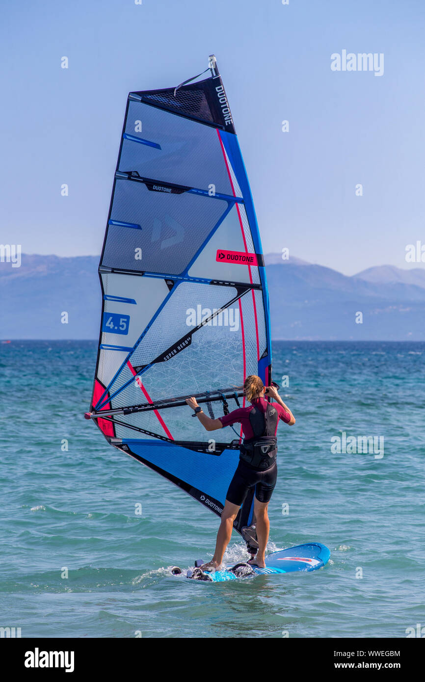 Woman Learning to Windsurf at Vasiliki, Lefkada / Lefkas Island, Greece Stock Photo