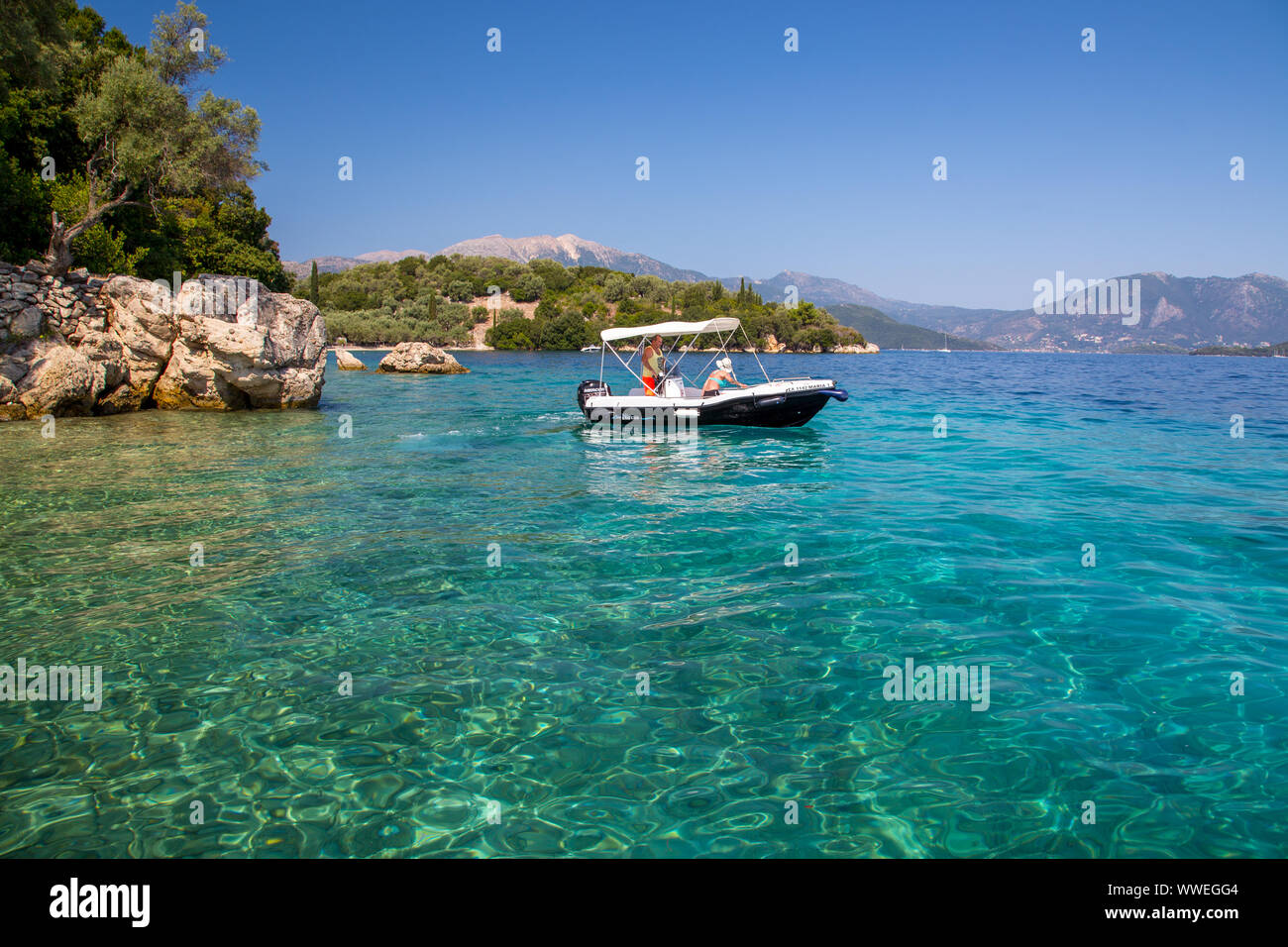 Rented 30HP motor boat at Meganisi Island near Lefkada / Lefkas Island, Greece Stock Photo