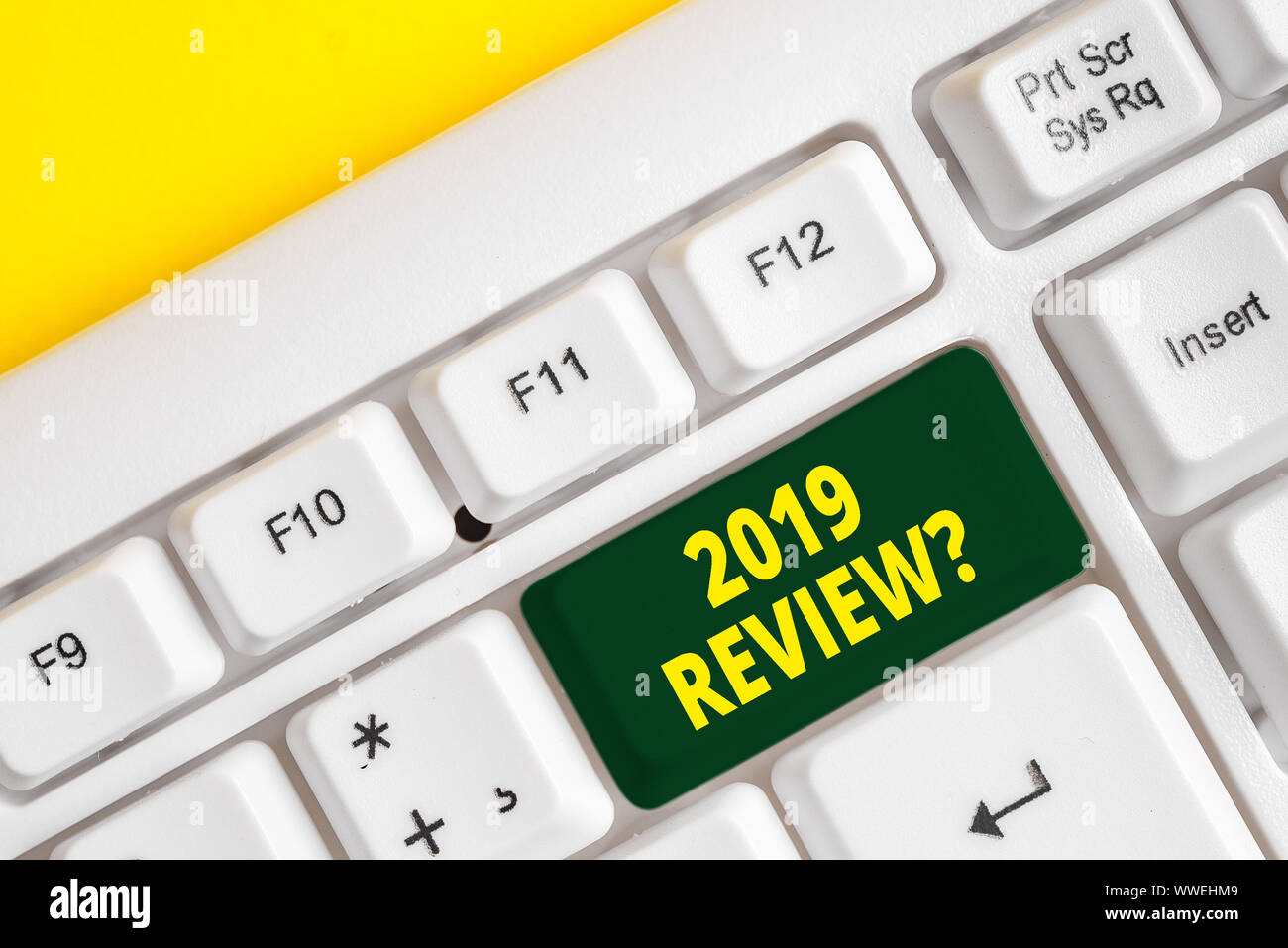 Word writing text 2019 Review Question. Business photo showcasing remembering past year events main actions or good shows White pc keyboard with empty Stock Photo