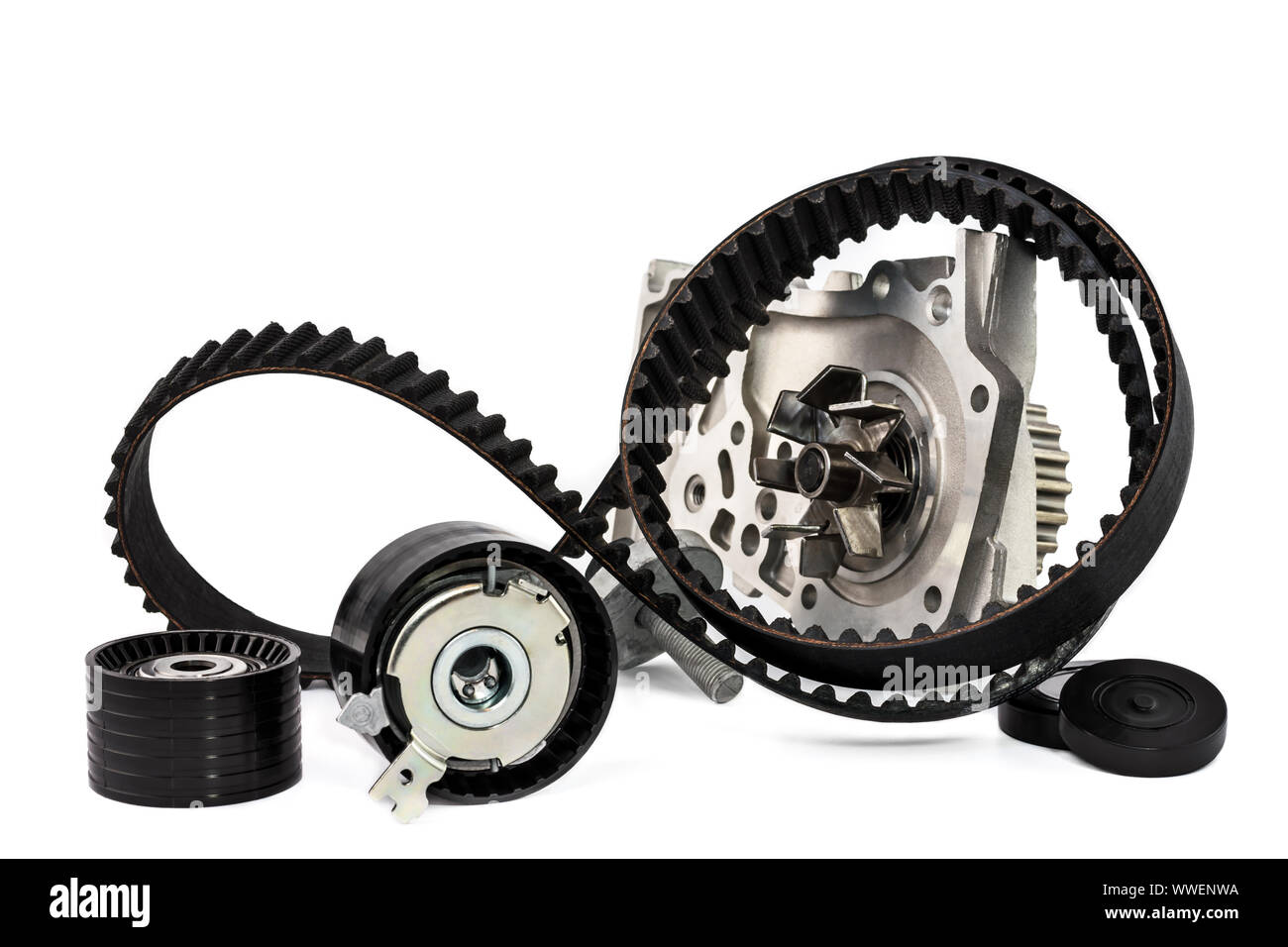 Spare parts for the car. The set of timing belt with rollers and cooling pump on a white background. Stock Photo