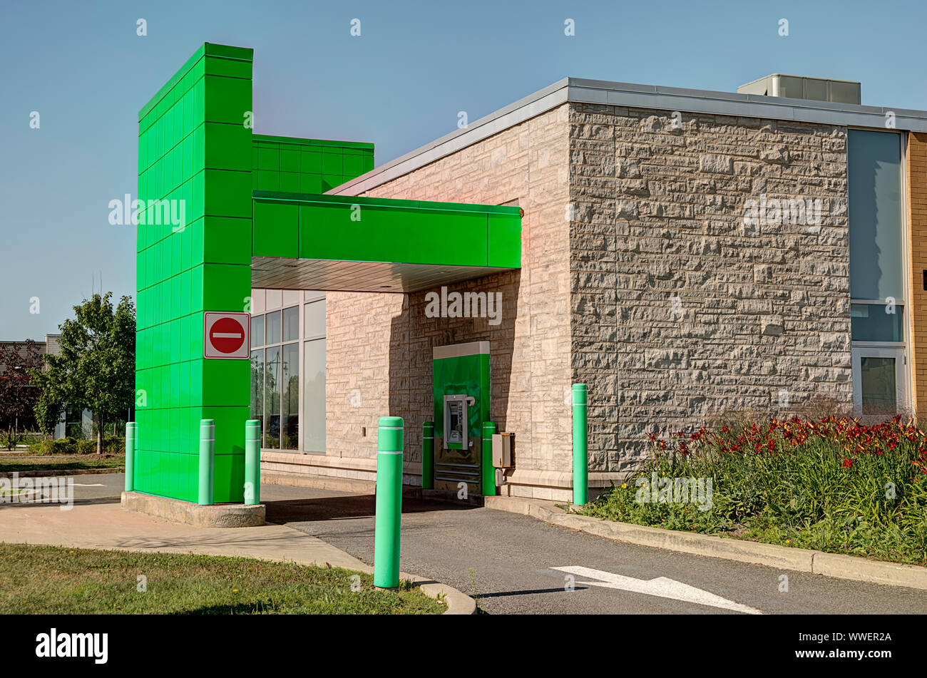 Bank drive thru on sunny summer day, blue sky in background. Stock Photo