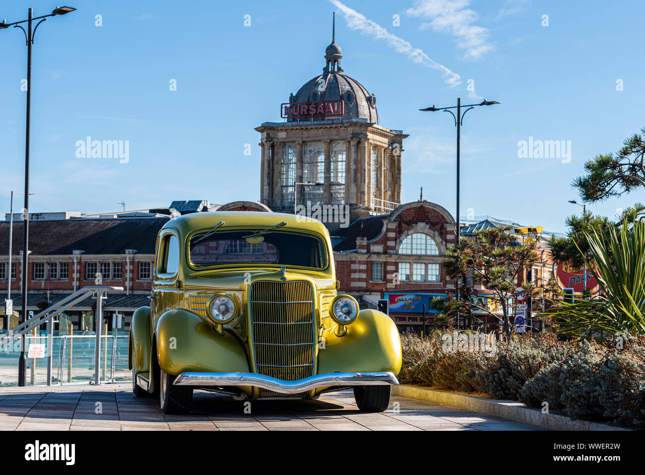 Classic car at Southend on Sea, Essex, UK. 1936 Ford with Kursaal on Marine Parade, Eastern Esplanade. Sunny blue sky Autumn day Stock Photo