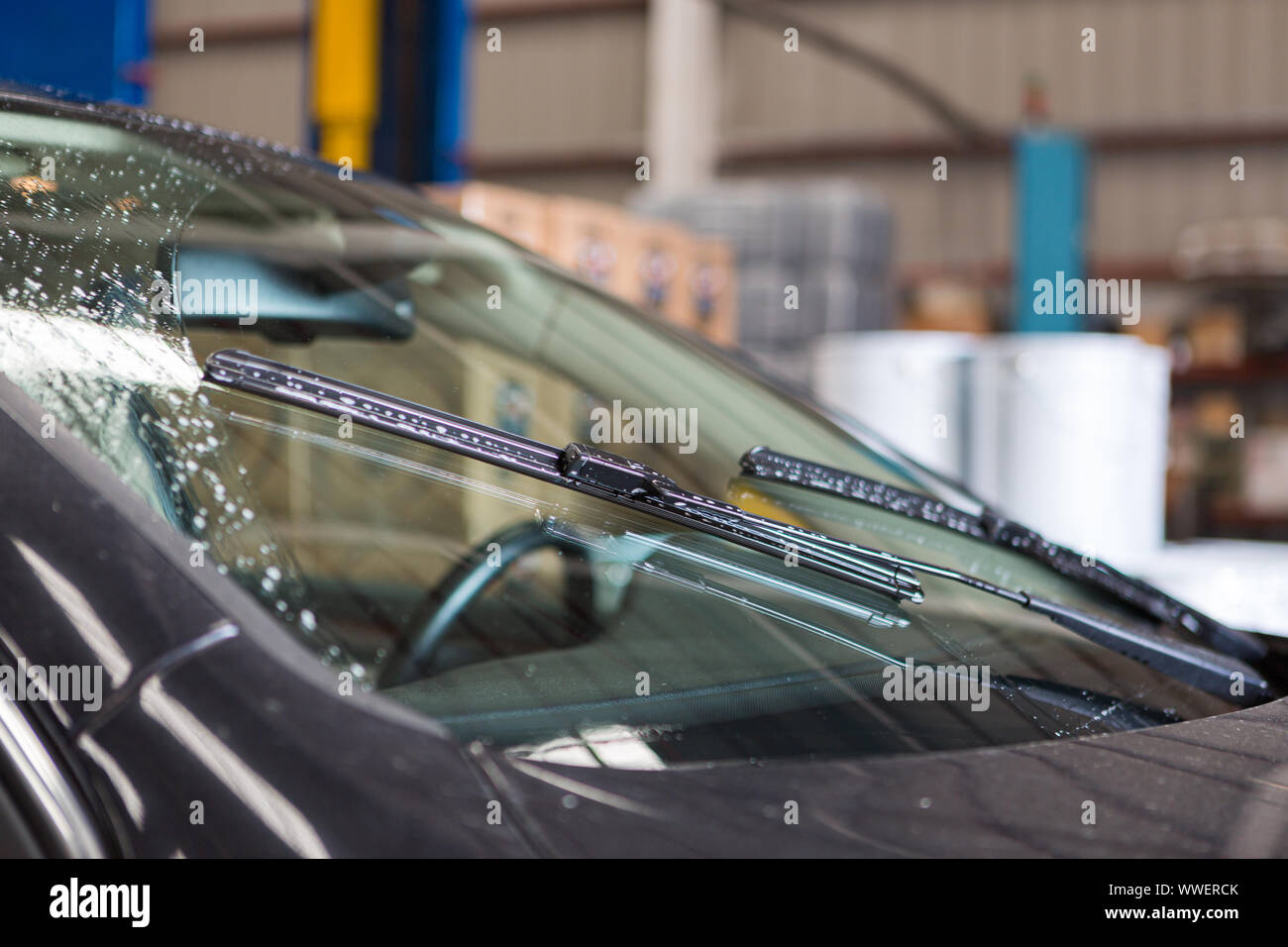 Detailed view of car windshield wipers while they are being used Stock Photo