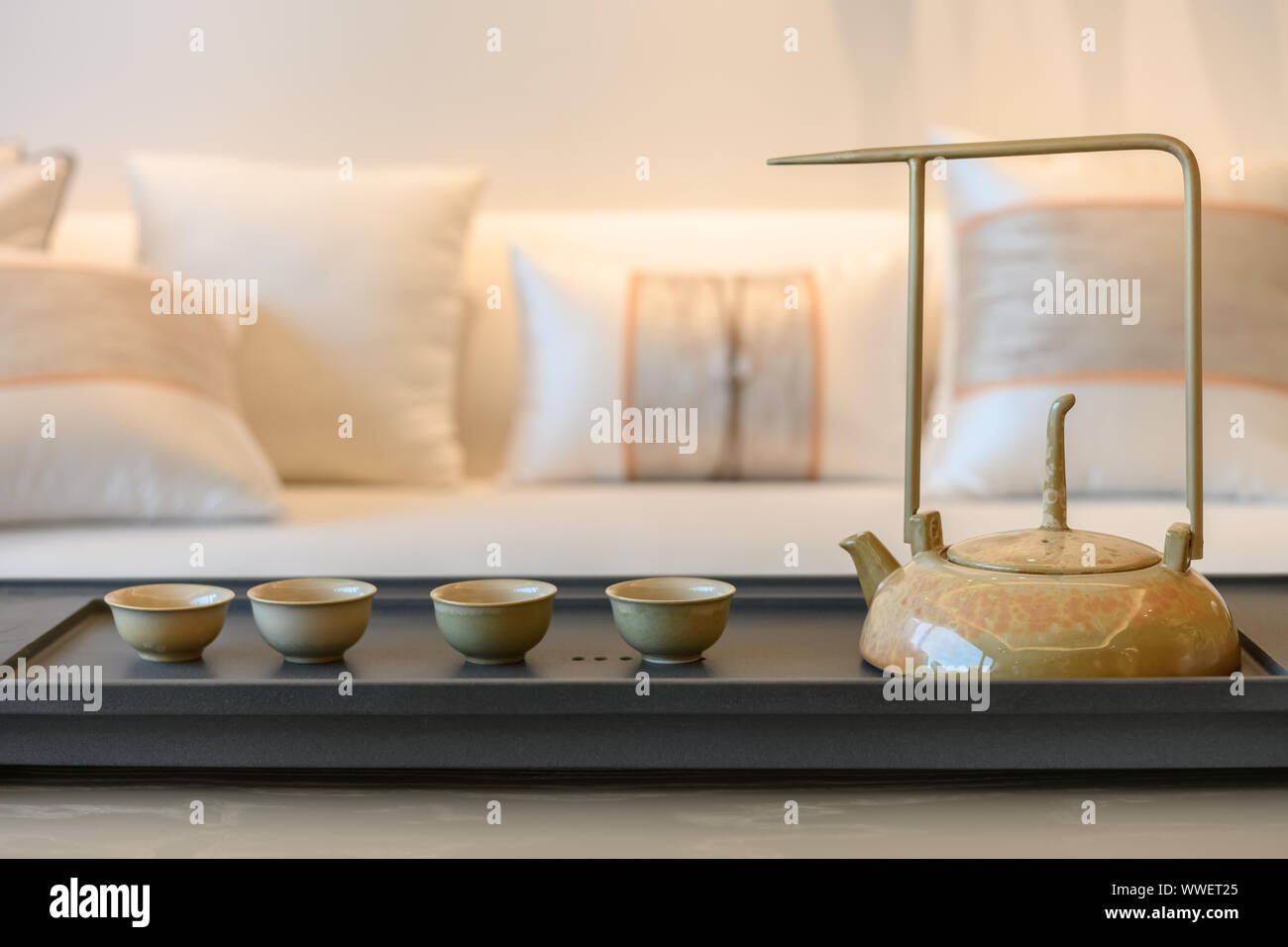 set of teapot and cups inside a living room Stock Photo Alamy