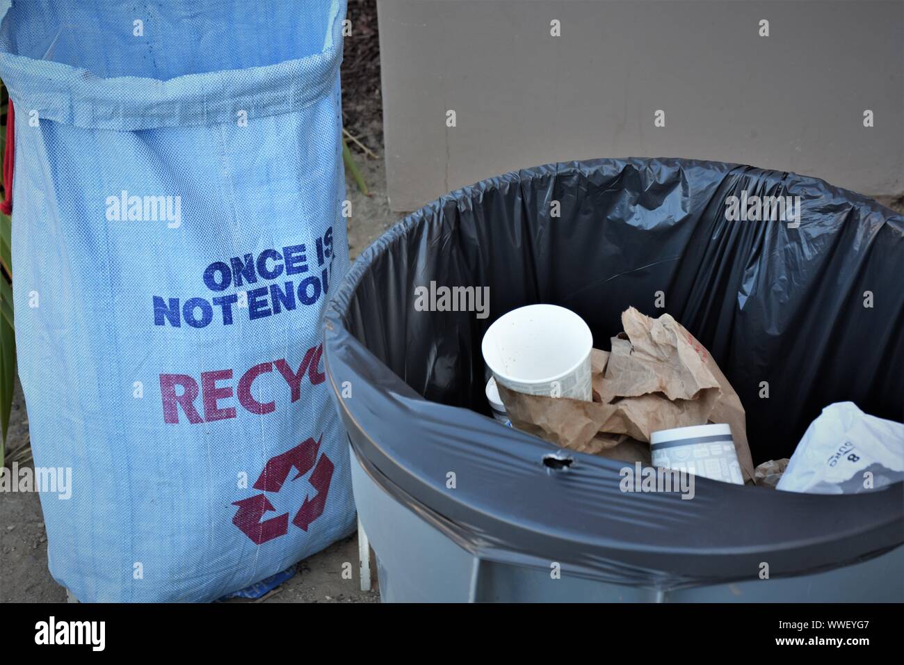 Sign and litter about recycling to safe the planet and make some money for the business - at a High school in Californian USA real daily accumulation Stock Photo