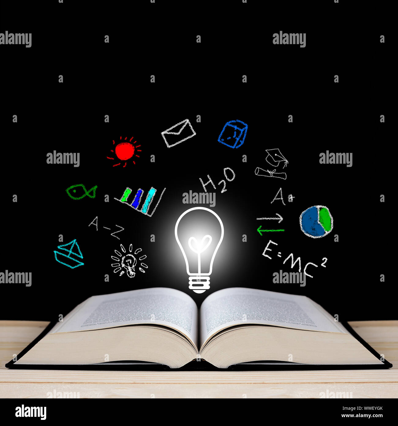Knowledge management concept, open book on blackboard, copy space Stock