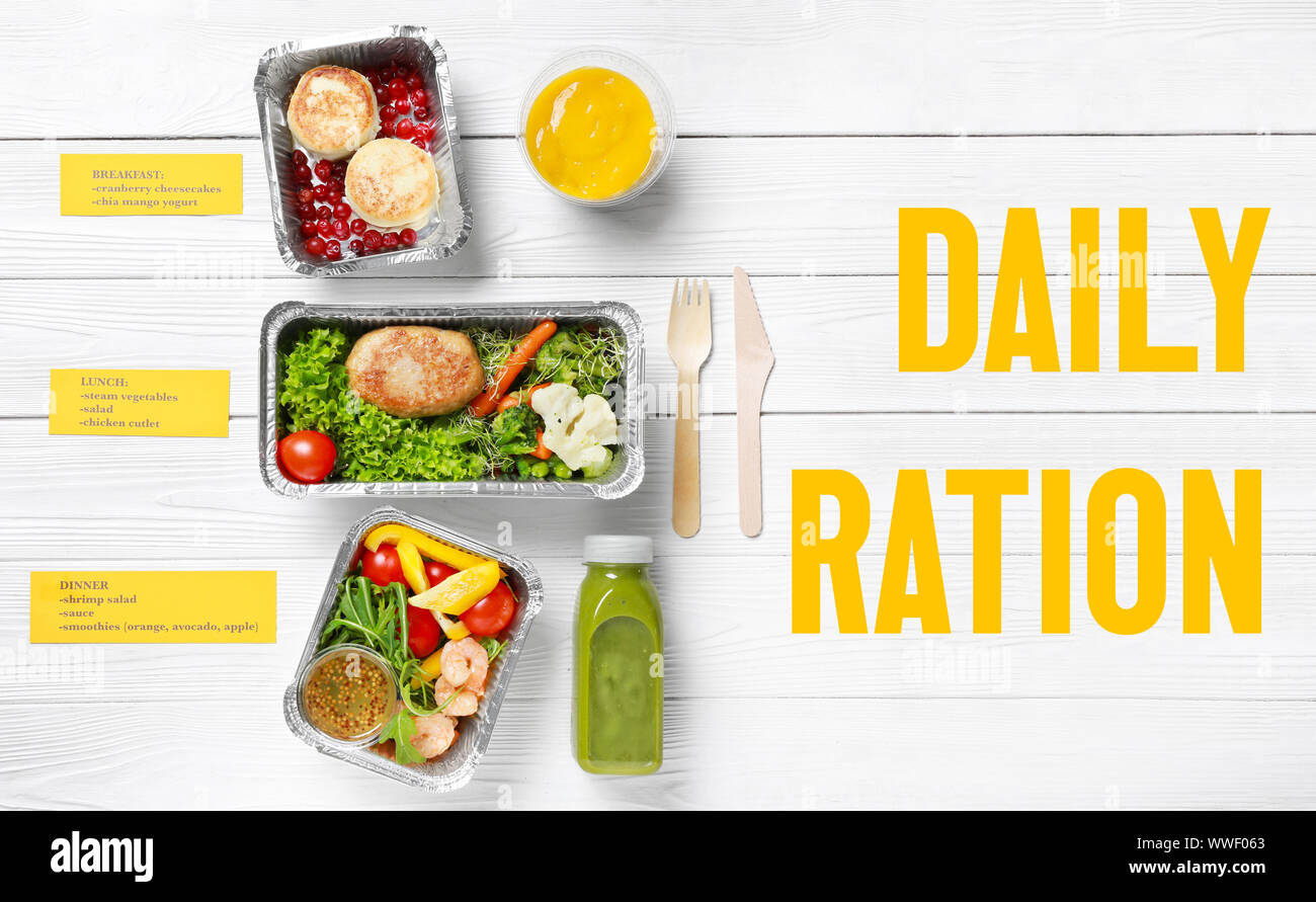 Containers with daily ration for delivery on white wooden table Stock ...