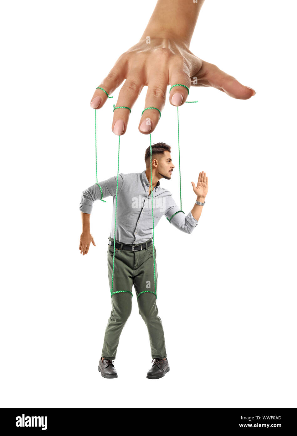 Hand Of Puppeteer Manipulating Man As Marionette On White Background Stock Photo Alamy