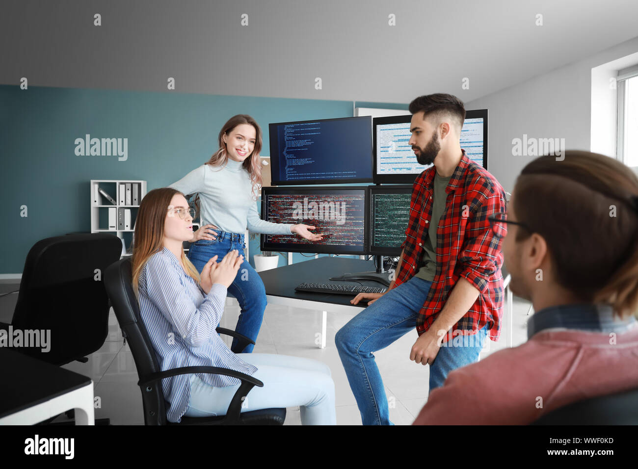 Team of programmers working in office Stock Photo