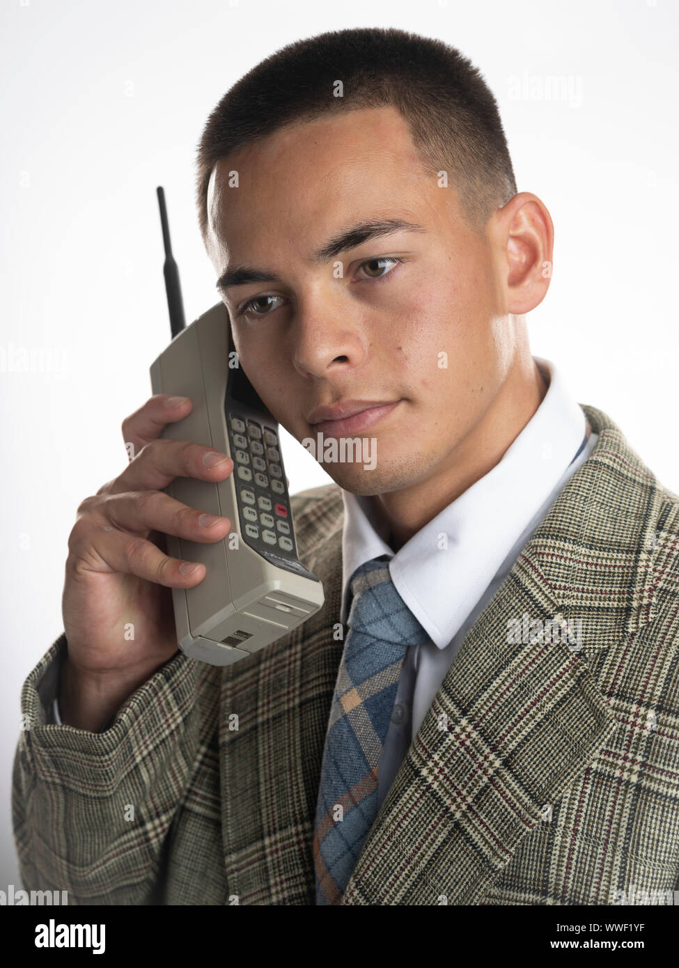 Man with 1980's  DynaTAC 8000 series mobile phone Stock Photo