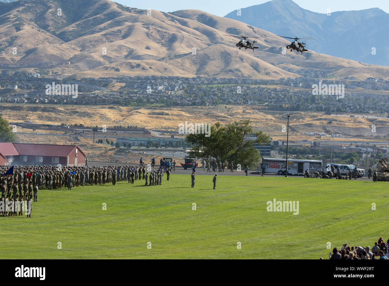 Army National Guard Apache helicopters fly over Tarbet field September 14, 2019, at Camp Williams, Utah for the 65th Annual Governors Day ceremony, one of Utah's proudest traditions.(U.S. Army Photo by Army Spc. Elizabeth Johnson) Stock Photo
